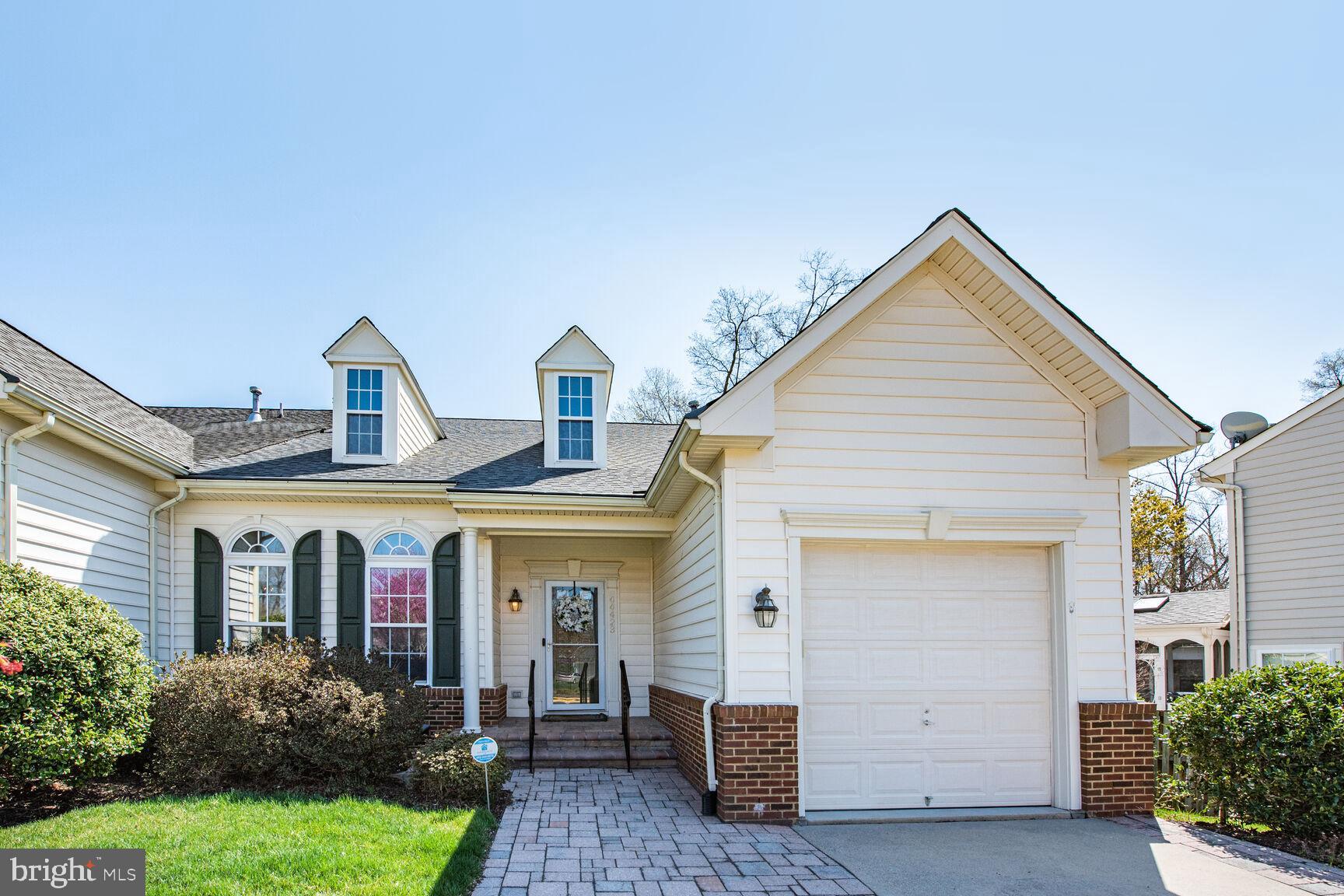 The Villas of Ashburn Village is an Active Adult 55+ community with all the amenities of Ashburn Village.  This lovely main-level end-unit townhome is on a premium lot backing to common area trees. The TOTAL square feet is approximately 3040sf.  It has 3 bedrooms and 2.5 baths.   Open main level floor plan has great natural light and wood floors.  The main level with lovely hardwood floor, includes the primary bedroom suite with primary bath soaking rub, separate shower and double sink vanity, eat-in kitchen that leads to screen porch and outside Trex deck, 3-sided gas fireplace share by the living and dining room, powder room, laundry/mud room, and garage.  Upper level has 2 additional large bedrooms with walk-in closets, open loft that is ideal for an office with a large walk-in closet, full bath with double vanity, and linen closet.   Large finished open lower level, plus extra room with French doors for office, exercise, crafts, workshop, etc. and rough-in plumbing for bath.  UPDATES:   Roof (2024), HVAC ((2024), Water Heater (2024), Washer/Dryer (2023).   Irrigation system in the front yard.  Ashburn Village has many amenities: the Sports Pavilion offers a fitness center, indoor and outdoor pools, racquetball courts, sauna, steam room, covered tennis/pickleball court.  Also include are neighborhood community center with outdoor pools, tennis, basketball, multipurpose courts and meeting rooms; 9 playgrounds, 50 miles of trails, baseball and soccer fields, a fit trail, over 500 acres of open outdoor space, as well as 8 lakes and ponds for catch and release fishing and canoeing.  The most unique amenity is the Sports Pavilion.  The $176 monthly dues includes cutting your grass and mulching the front yard landscape!  The Ashburn Senior Center run by Loudoun County is across the street from The Villas of Ashburn Village.   The Senior Center has numerous activities for you to enjoy. The Villas are convenient to Loudoun County Parkway, Rt. 7, Rt. 28, Dulles International Airport and The Ashburn Station (Silver Line Metro) is less that 5 miles.  Convenient to shopping within Ashburn, One Loudoun, Dulles Town Center, restaurants, entertainment and the INOVA Hospital Campus.