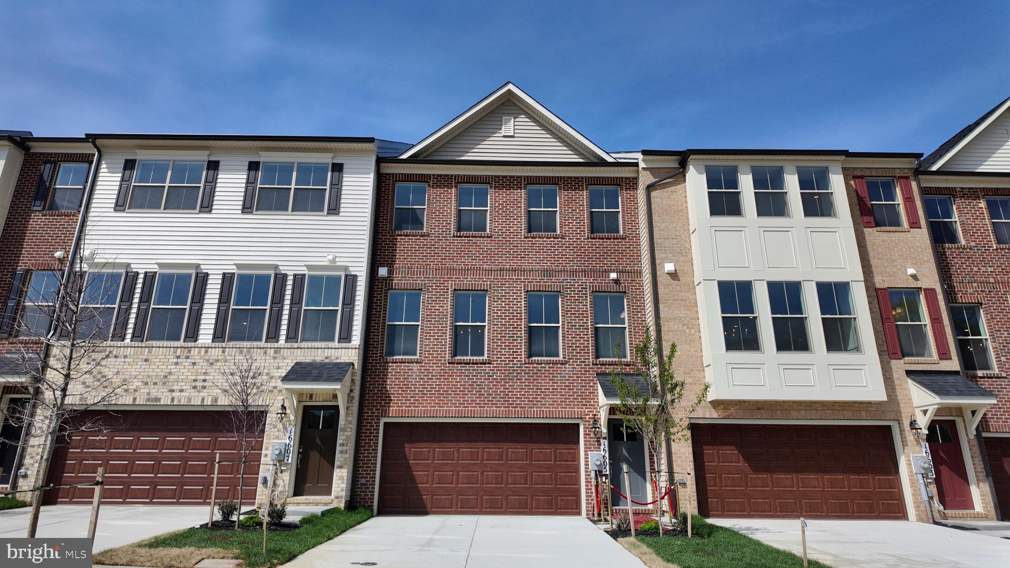 Welcome to 16605 Aruba Drive, a newly constructed Patuxent townhome located in the Manning Square Towns community in Accokeek, Maryland. This three-level home features a classic brick front and an open-concept layout that supports both everyday living and entertaining. The main level centers around a well-appointed kitchen with a large island, stone countertops, and stainless steel appliances, and flows into the Great Room, which features an electric fireplace.

The finished lower level offers additional living space with a recreation room and a full bath, providing flexibility for guests, a home office, or a secondary lounge area. Upstairs, the primary suite includes a private en-suite bath and walk-in closets, while a conveniently located upper-level laundry room adds everyday ease.

Built with energy-efficient features and backed by a comprehensive builder warranty, this home offers modern design perfect for your lifestyle.
 
Don't wait on your new home dreams! Elevate your lifestyle today at Manning Square Towns, a prestigious Caruso Homes community offering luxury garage townhomes and premium amenities.  Embrace life near the Potomac with scenic river views and nature trails at Piscataway Park, plus convenient access to Washington, D.C., Southern Maryland, and Northern Virginia. Interior photos are of a similar plan and are for representation only - Contact Caruso Homes for more information.