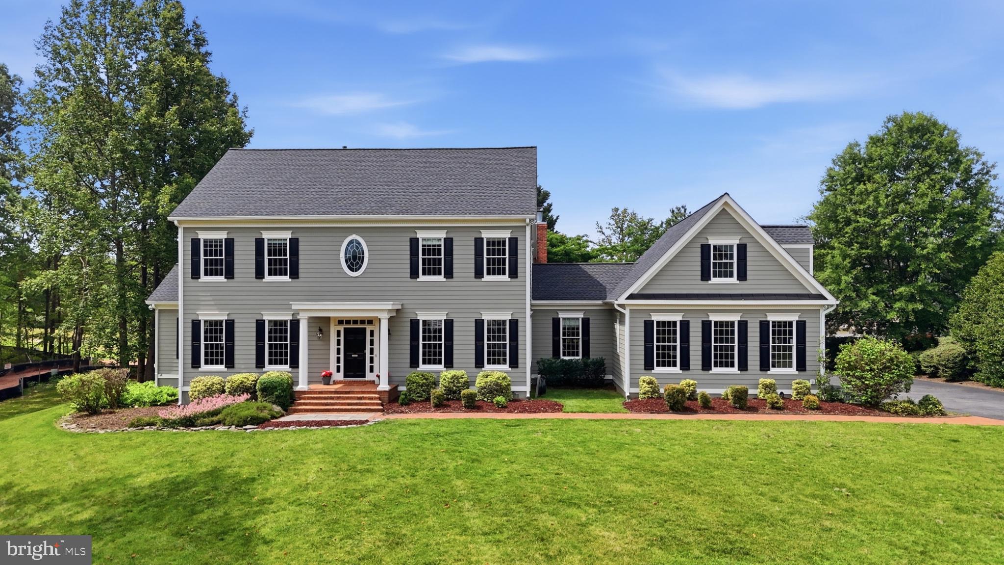 Welcome to Chapel Bridge Estates, where timeless design and generous scale come together in this beautifully maintained custom home offering over 6,800 finished square feet in one of Fairfax Station’s most desirable communities. Located in the sought after Sangster Elementary and Lake Braddock Secondary school pyramid, this impressive 7 bedroom, 4.5 bath home features durable concrete siding, an oversized side load 3 car garage, 10 foot ceilings on the main level, 9 foot ceilings on the upper and lower levels, gleaming hardwood floors, extensive moldings, arched openings, custom built ins, and sun filled rooms throughout. The main level primary suite offers a private office, 2 walk in closets, and a spacious bath with dual vanities, a remodeled primary shower completed in 2023, new windows and glass door in 2025, and a soaking tub. Formal living and dining rooms, a large family room with fireplace, and an expansive kitchen with abundant cabinetry, island prep space, bar and table seating, 2 pantries, and quality appliances create an exceptional layout for everyday living and entertaining. Just off the kitchen, the Sunroom adds bright additional living space overlooking the beautifully landscaped yard. Upstairs, 5 spacious bedrooms, well appointed baths, a charming library loft, bedroom level laundry, and partial new paint on the upper level enhance the home’s thoughtful design. The finished lower level offers a large recreation area, flexible bonus space, full bath, 7th bedroom, a secondary laundry room, and extensive unfinished storage. Additional updates include a new roof in 2022, a new furnace in 2022, and a new washer, dryer, and refrigerator in 2023. An added future benefit is the planned road connection, expected to enhance neighborhood access and make walks and strolls through the community even more enjoyable. Enjoy close proximity to South Run Swim and Racquet Club, Burke Lake Park, Burke Lake Golf Center, Burke Centre Shopping Center, and South Run Rec Center, plus Lake Mercer, Fountainhead Regional Park, Historic Clifton, Hidden Pond Nature Center, Springfield Town Center, Country Club of Fairfax, Fair Lakes Shopping Center, Fair Oaks Mall, Fairfax Corner, Lake Accotink Park, Audrey Moore Rec Center, and Laurel Hill Golf Club. Commuters will appreciate convenient access to Fairfax County Parkway, Route 123, Burke Centre VRE, and Franconia Springfield Metro for strong connectivity into Washington, DC and throughout Northern Virginia.
