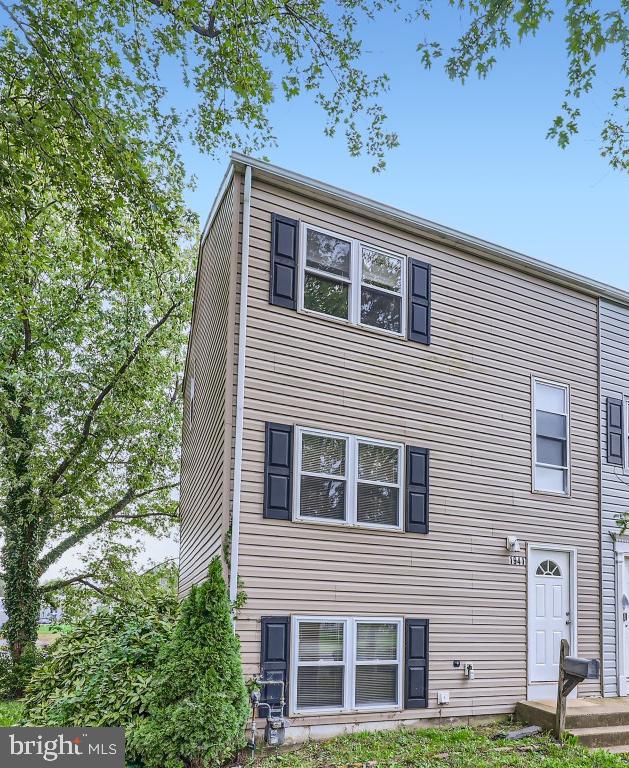 3 Bedroom 1.5 Bath End of Group Townhome.  Three Levels of Living Space and view of Lake from Rear Deck.  Upper Level Features 3 Bedrooms and 1 Full Bath, Main Level Features Updated Kitchen with Granite Counters, Half Bath, and Living Dining / Combination with Access to Deck.  Lower Finished Level offers additional Living Space, Laundry Storage Area and Slider to Rear Patio.