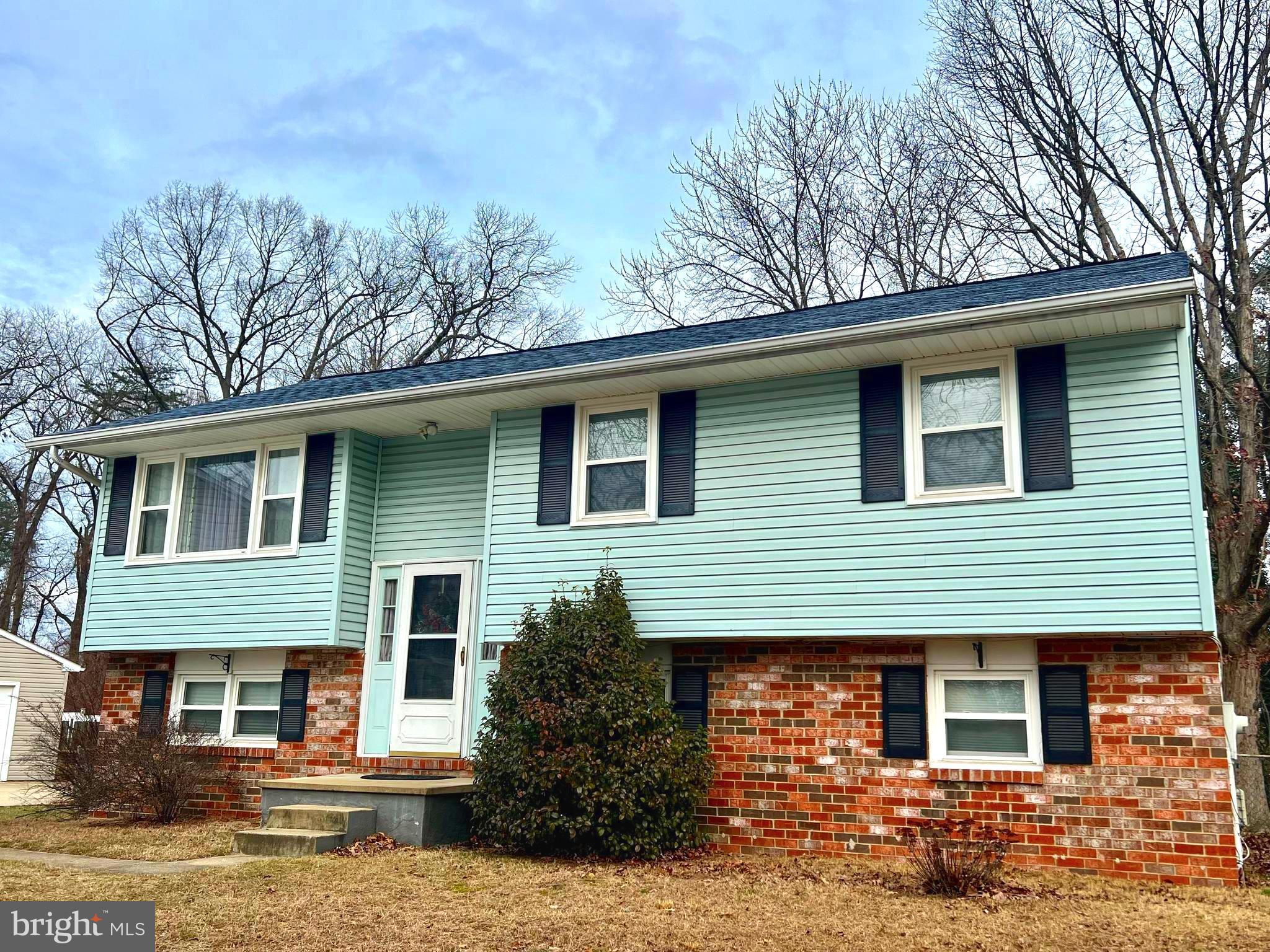 Inviting 4 bedroom property tucked away on a tree lined cul-de-sac street with sidewalk access to the BWI Trail. At a full 2100 square feet, this home offers amble living on both levels. 3 large bedrooms on main floor with Eat in Kitchen, Living and Dining Room Combination leads to your Den/Home-Office. Lower level includes a 4th bedroom with its own Full Bath ensuite, large Recreation room, Stove Fireplace with a beautiful Brick chimney and hearth that provides a warm setting for recreation and entertaining. Enjoy convenient walk-out to the 2 Tiered back deck from the kitchen that overlooks a sprawling fenced in backyard with shed and basket ball area. Lower level also provides walk-out access to backyard though an enclosed porch area perfect summertime gatherings. Updates include AC unit 3 years old, Roof less than 3 years old and newer water heater and dryer. Conveniently located with access to public transportation and major interstates.  1 YR Home Warranty Included. MAKE YOUR APPOINTMENT TODAY!