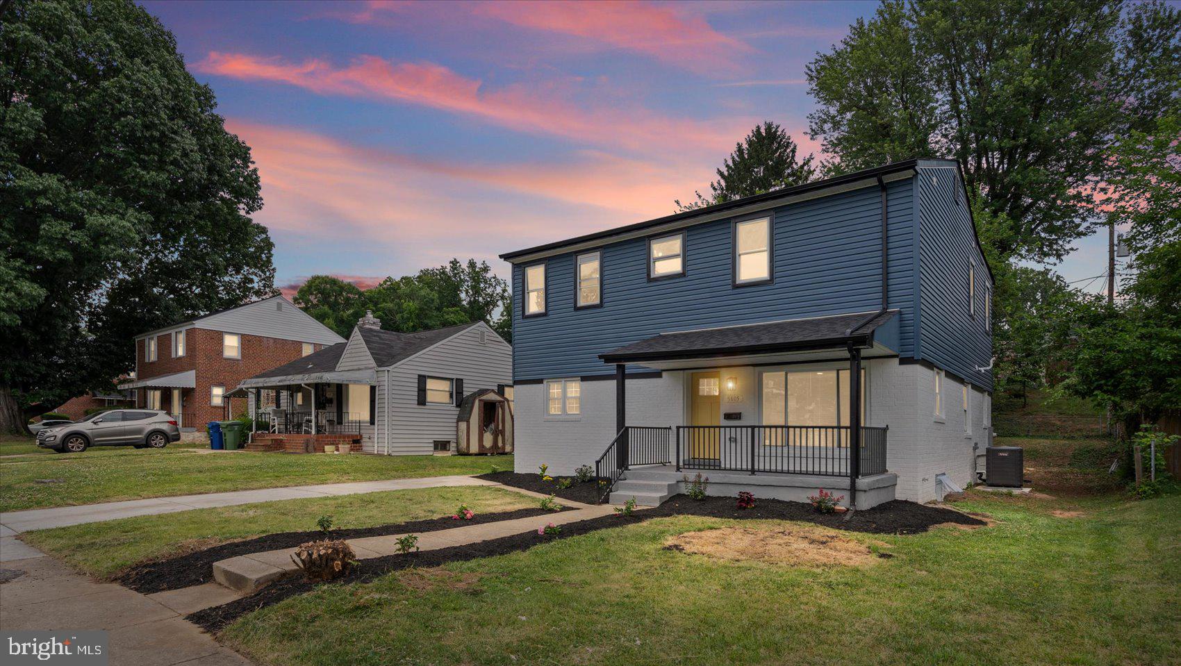A stunning transformation has taken place behind the front door of this adorable 2,643 sqft 4BR/4.5BA home, which sits on a sizable lot in a quiet neighborhood..  Park in your private driveway, pass the newly planted landscaping, and step up to the covered front porch of your forever home. Open the door and step inside a home filled with natural light, a soft color palette, recessed lighting, stunning wide plank wood flooring on the main floor, and luxury flooring, carpet, and tile throughout.  The stunning open concept main floor features a family room with a custom feature wall and a gas fireplace, an open living room, a dining area, a stunning kitchen, and a half bath.  The kitchen boasts ample cabinetry, sleek quartz countertops with a tiled backsplash, stainless steel appliances, and a stainless sink under a window.  The second floor features the convenience of laundry facilities, two spacious secondary bedrooms both with private full bathrooms (one featuring a walk-in closet), and a grand sized primary suite. The primary bedroom is a large room featuring a walk-in closet and a private ensuite with floating his/hers sink vanities and a beautifully tiled walk-in shower that includes a built-in bench.  The lower level provides additional living space featuring the fourth bedroom, a full bath with a walk-in shower, a large recreation room for the entire family, storage and utilities.  From the main floor step outside to not one, but two newly constructed decks that overlook a yard filled with green space and possibilities.  This move-in-ready home is ideal for any new homeowner and is close to shopping, restaurants, and commuter routes.