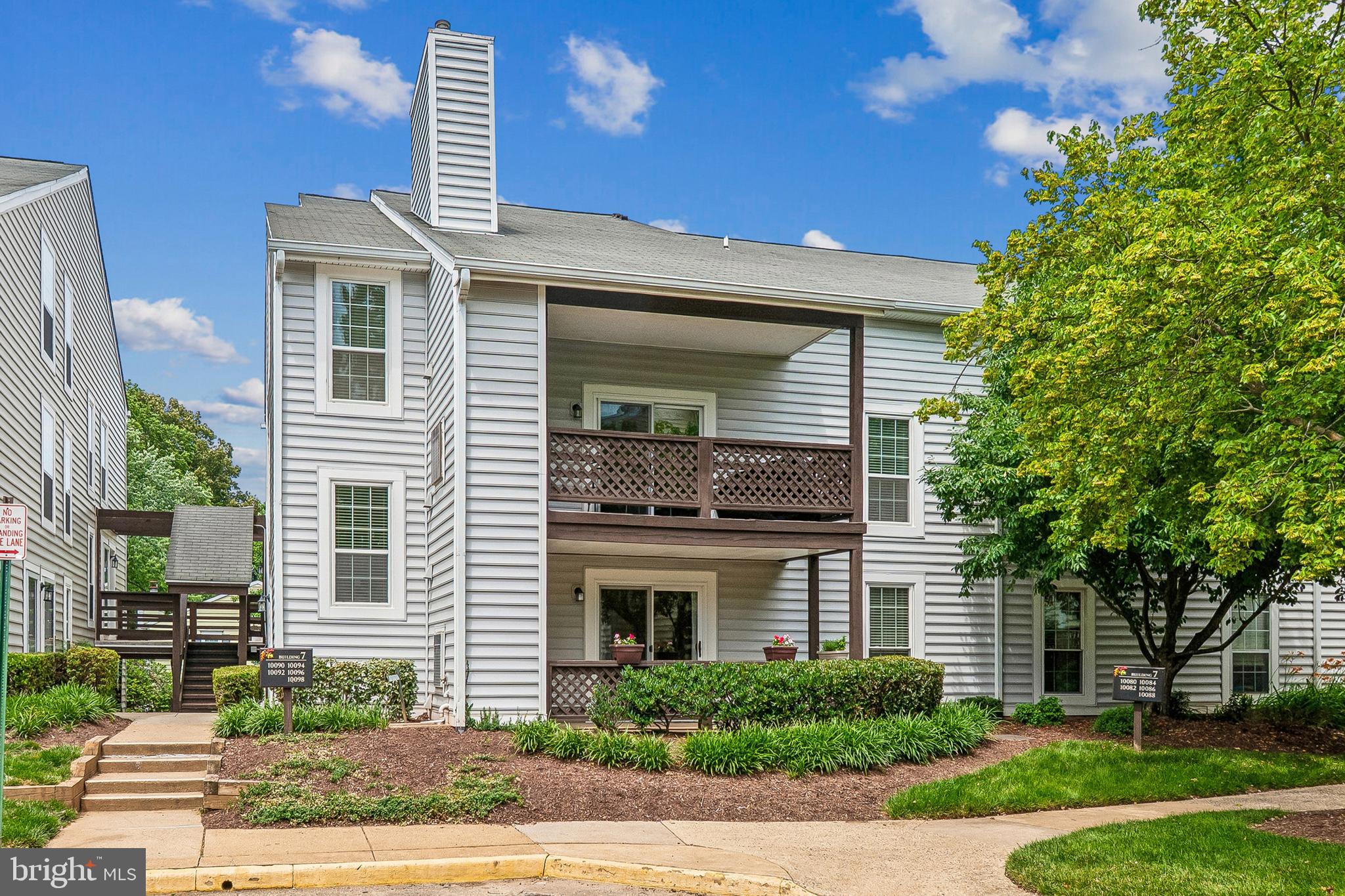 Welcome to The Oakton — where comfort, convenience, and quality upgrades come together in this meticulously maintained first-floor condo!
This beautifully updated 2-bedroom, 1-bath unit has been thoughtfully improved throughout. Brand new LVP flooring (2021) flows through the entire unit, complemented by a new HVAC and water heater (2024) and Castle windows and sliding glass door (2015) — which come with a lifetime warranty — giving you true peace of mind from day one.
The inviting living room features a cozy fireplace and opens directly to a large, covered balcony — perfect for morning coffee or evening relaxation. The dining area flows naturally off the living space, creating an easy, comfortable layout for everyday living and entertaining.
The primary bedroom boasts a large walk-in closet, while the well-appointed bath offers a smart split design separating the shower area from the toilet area. A spacious laundry room with full-size washer and dryer plus wall-mounted cabinets adds exceptional storage rarely found in condo living.
Located just one mile from the Vienna Metro and I-66, The Oakton community offers beautifully maintained grounds, a swimming pool, and private parking. Enjoy easy access to Blake Lane Park's walking trails and green space, the Oakmont Recreation Center, and the charming Town of Vienna — all while maintaining a quiet neighborhood feel with quick access to shopping, dining, and major commuter routes.
