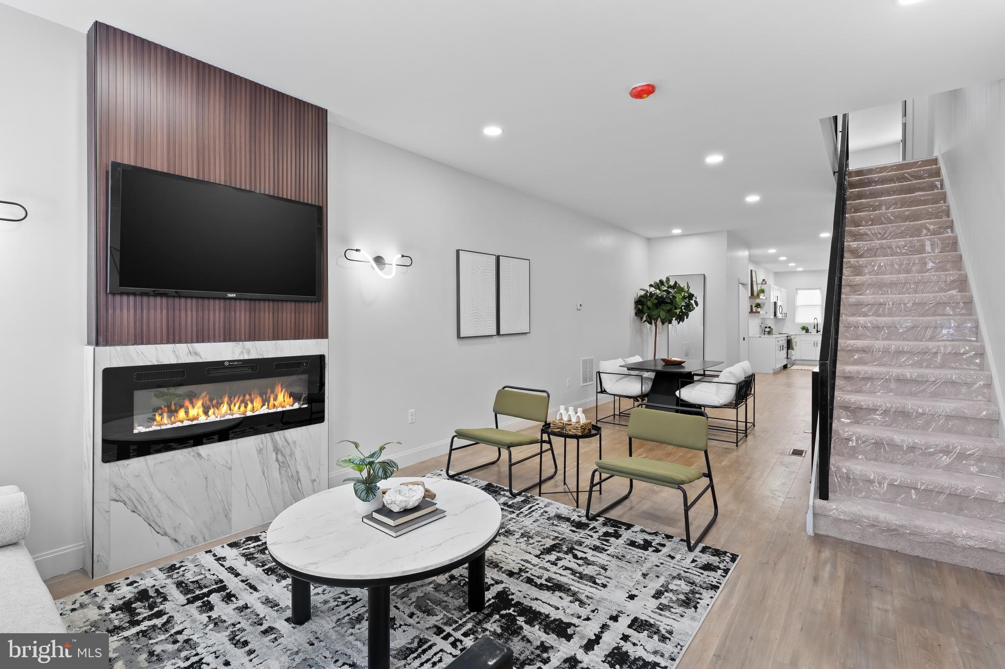 Welcome to 723 E. 20th St. – A Stunning, Fully Renovated Baltimore Townhome

Discover upscale style and modern elegance in this beautifully transformed 4-bedroom, 2.5-bath townhome—the first of many revitalizations planned for this block. Behind its charming façade, you’ll find a thoughtfully designed home perfect for entertaining and everyday living.

Step inside to a bright, open-concept main level featuring soaring ceilings, warm wood flooring, and abundant natural light. The spacious living area is anchored by a cozy fireplace, creating a welcoming atmosphere year-round.

The chef’s kitchen is a true showstopper, boasting sleek rose quartz countertops, a deep stainless steel sink, top-of-the-line stainless steel appliances, and even a built-in wine refrigerator—ideal for hosting and relaxing in style.

From the dining area, step out to a fenced backyard brimming with possibilities—perfect for gatherings, gardening, or simply unwinding in your private outdoor space.

Upstairs, the second level offers three generously sized bedrooms and a convenient washer/dryer hookup. The third floor is dedicated to a luxurious primary suite oasis, featuring a spa-like en-suite bathroom that invites you to relax and recharge.

This home is truly move-in ready with brand-new roofing, plumbing, electrical, mechanical, and structural systems—providing peace of mind and lasting value.

Situated close to shopping, restaurants, and commuter routes, this elegant home blends modern comfort with urban convenience. Don’t miss your opportunity to own a piece of Charm City’s bright future!