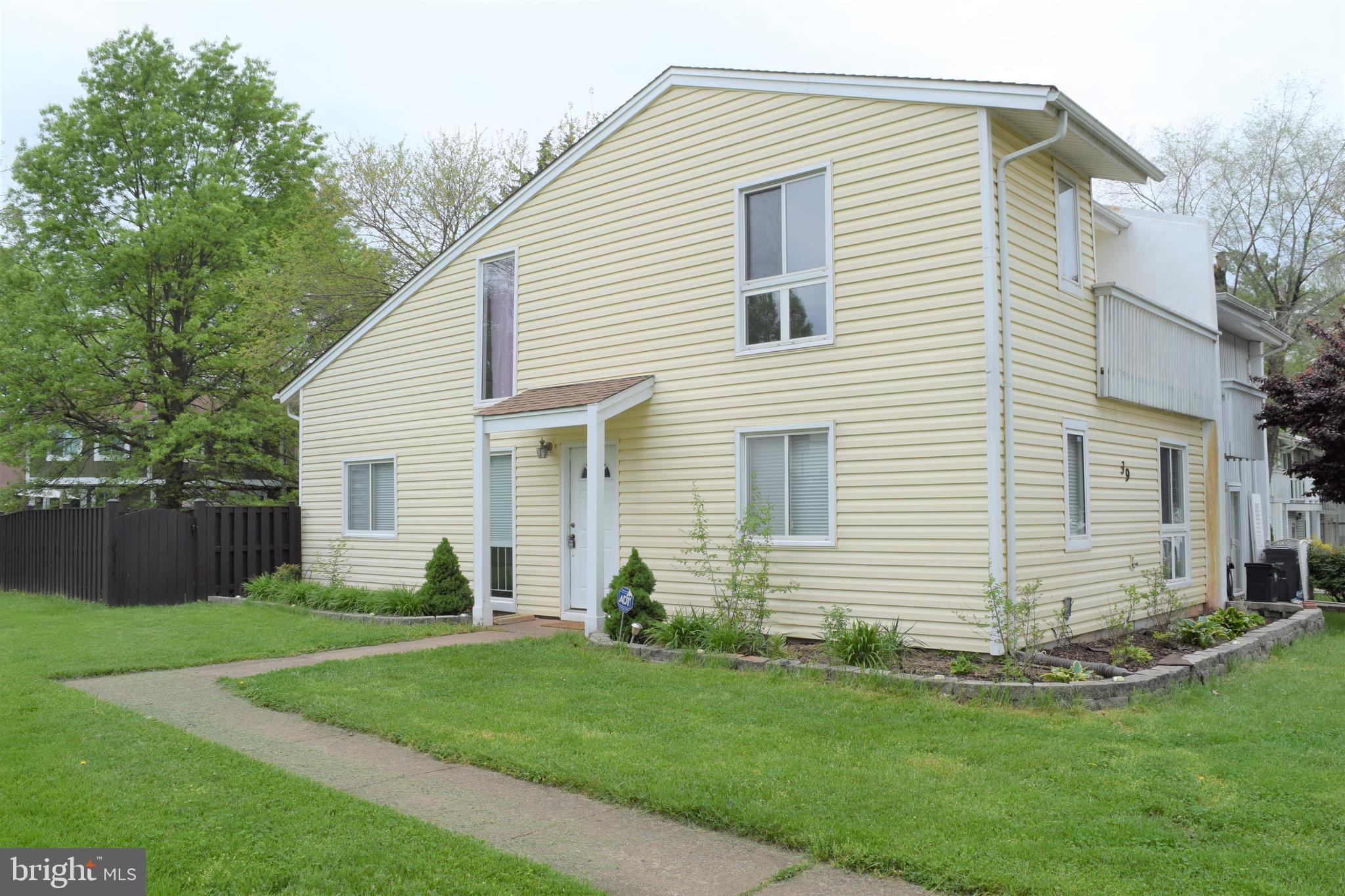 End unit Townhome boosting Stainless Steel Appliances, Granite Counter Tops, and Energy Efficient Washer/Dryer . Hardwood flooring thru out the Main Level.  Master Suite with large Balcony, Walk In Closet. Large Windows let the sunshine in for plenty of natural lighting! Home faces walking trail & trees. 2 Assigned Parking Spaces! Fully fenced backyard with ample greenspace.
