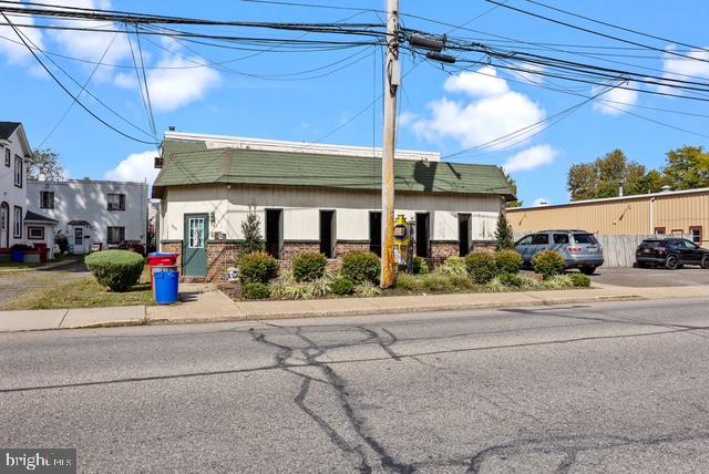 Just Reduced!! Up and running busy Auto Body shop located in desirable Historical Bristol Boro!! Features customer sitting area, receptionist desk, back office, storage closets, two 1/2 bathrooms, 6 garages, 5 drive in doors, fenced, above shop has 2-bedroom apartment with 1 bath, long term tenant pays $900 a month, tenant pays electric only. separate meters, roof only 2 years old. above shop has been recoded 2 years ago, storage shed, one block from the Delaware river and much more!!