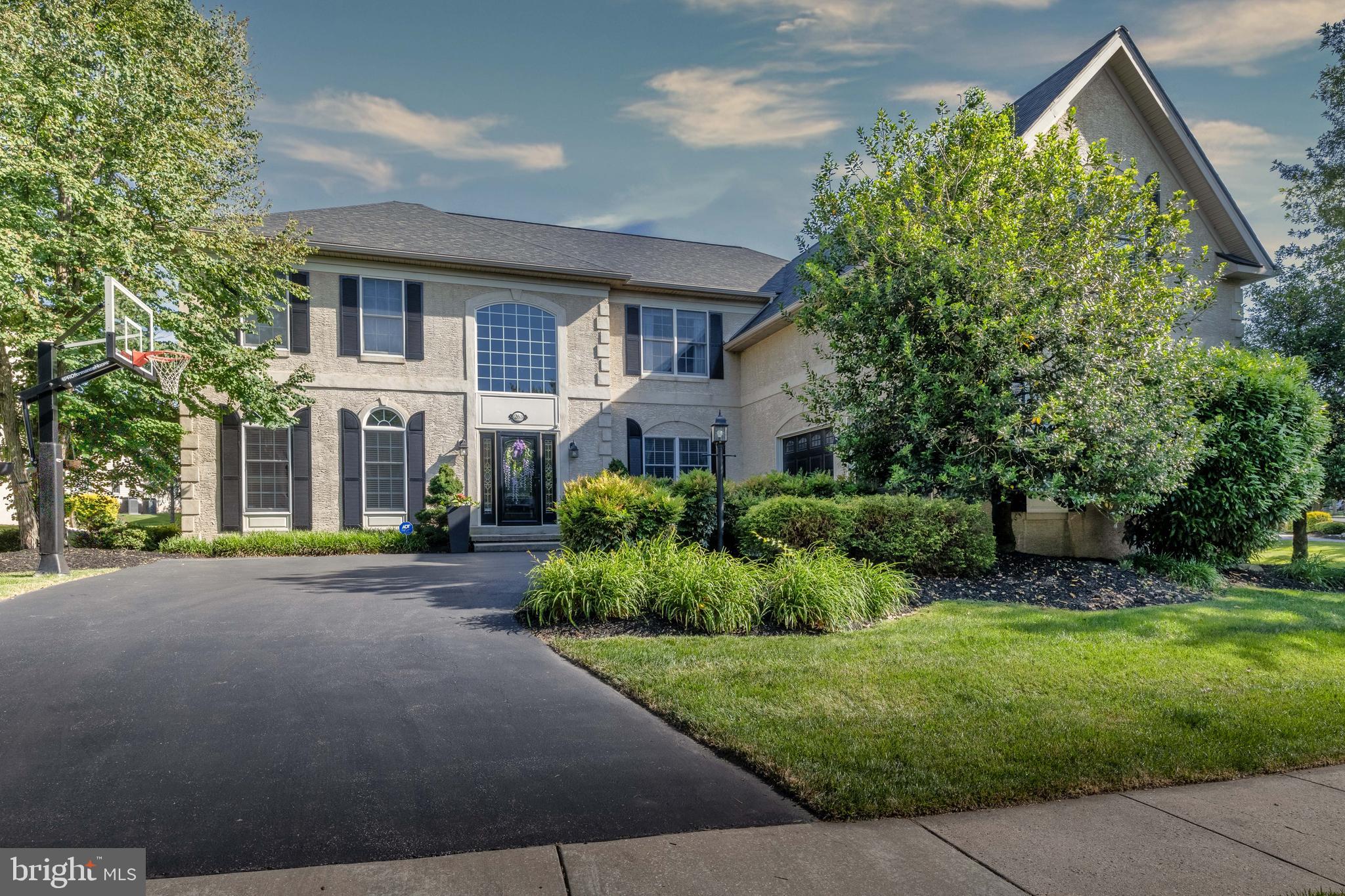 Description:
Welcome to the prestigious gated community of Rivercrest, where this Estate home offers luxury in a premier Country Club Community with every amenity conveniently located within a short walk.  These amenities include a pool, across from the clubhouse, gym, , walking trails throughout the 50-acre open space, and complete HOA services. Upon entering this home, you will notice the soaring space and elegant curved staircase. Spacious, immaculately maintained, and a floor plan made for living and entertaining. This impressive home includes 4-5 bedrooms, 4 full and 2 half baths, 5100+ SF of living space, including a huge finished lower level.  The kitchen will impress your friends and family with a convenient pantry space, expansive quartz island to host friends and family, luxury appliances and a kitchen sink overlooking the back yard.  The impressive floor to ceiling stone fireplace and wall of windows make a bold statement in the great room and from the back stairs.  The first floor offers beautiful hardwood flooring and tile throughout its circular floor plan. The finished basement simply has too many possibilities to list... office, 5th bedroom, craft/ hobby room, a home gym, bar, and entertainment center along with ample storage. The dining room has plenty of space to entertain family & friends, and additional living room and private office.  Upstairs, the Primary Suite offers a quiet retreat and ensuite ideal for pampering… sporting a relaxing soaking tub, separate shower, private water closet, two spacious walk-in closets and extensive counters top off this private space. Down the hall, a Junior Suite with its own full bath would be a great option for a teen or visiting in-law. Bedrooms 3 and 4 share a jack and jill bath. All bedrooms feature walk-in closets. The impressive, finished basement, with egress window, offers a powder room, a full bar with beer meister tap, wine cooler/ refrigerator and sink, a separate TV viewing area, workout room, possible 5th bedroom and a craft room with tons of cabinets and counters for work areas that’s just perfect for crafts, a home business, home school or an excellent space to organize a hobby. Additionally, there is a large unfinished storage area and closet within the basement.  Additionally, there’s ample  storage within with the oversized two car garage. A patio and hot tub are a few steps from the kitchen, making entertaining a breeze. This home is ready to move in and enjoy the lifestyle The Rivercrest Country Club offers, whether its carefree living, a Rivercrest social membership or an elite golf course, all conveniently located a few minutes from Collegeville Town Center, the energy of downtown Phoenixville with its restaurants and nightlife, or the short drive to King of Prussia’s shopping.  Welcome home to Rivercrest, your new gated community lifestyle!  Stucco inspection coming soon.  Includes a water conditioning system.