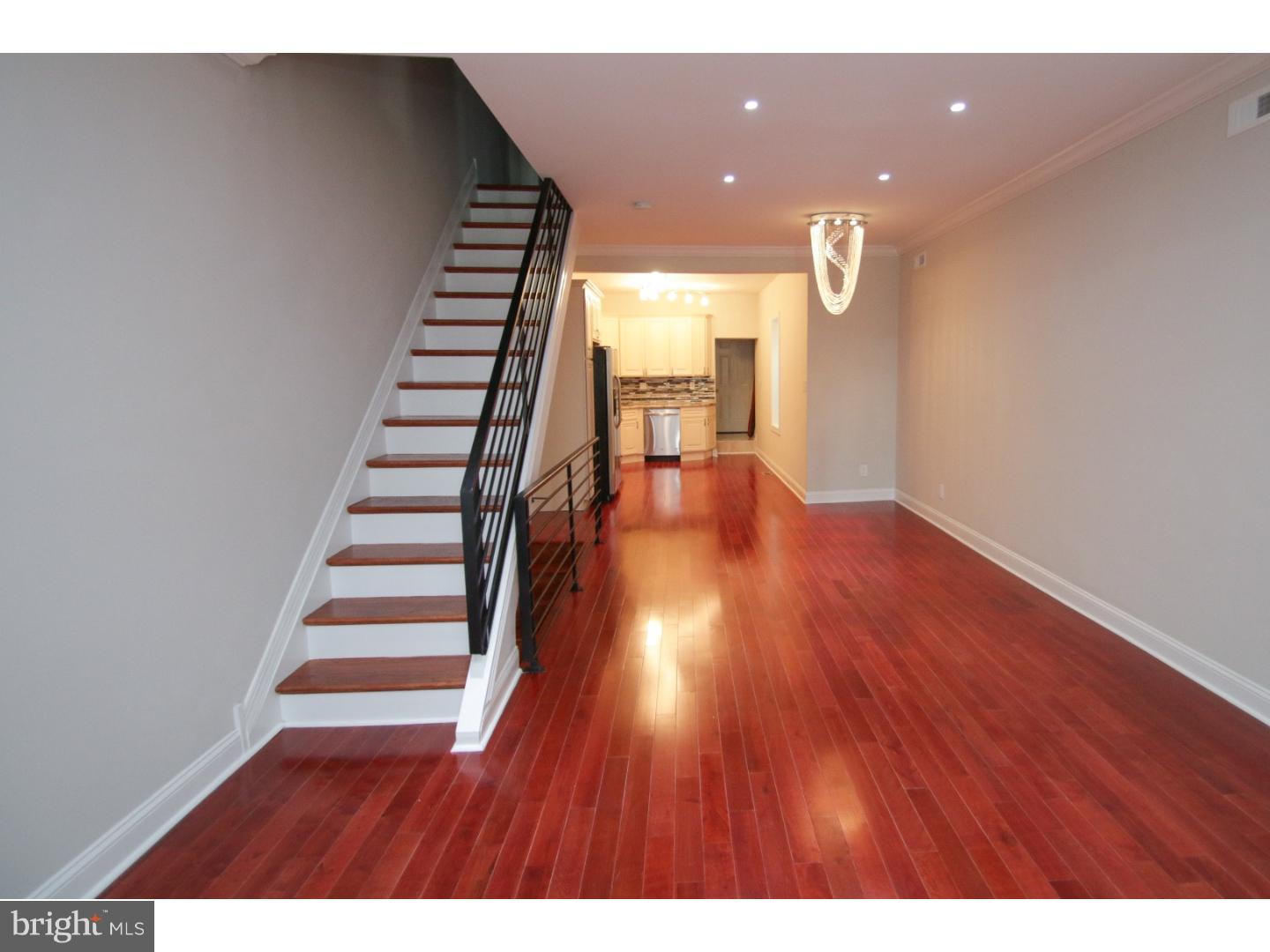 Amazing property in Point Breeze, fully rehabbed with amazing craftsmanship and detail!  This home has undergone a full renovation and has every extra your looking for.  The first and second floor boost Brazilian Cherry Hardwood flooring and an open layout leading to a chef's kitchen w/ gorgeous granite counters and 42' cabinets! All new Stainless Steel Appliances have been added to include a built-in fridge.  The upstairs has 3 very spacious bedrooms with large closets and a spa bath with a corner Jacuzzi tub. The rear bedroom has a custom built balcony and throughout the home you will see all ceilings are exceptionally high! The basement has also been fully renovated with very usable space, to include all new Porcelain tile flooring, a powder room and laundry area.  Other key features include a half bath on the first floor for convenience and a gated backyard and built in picnic table.
