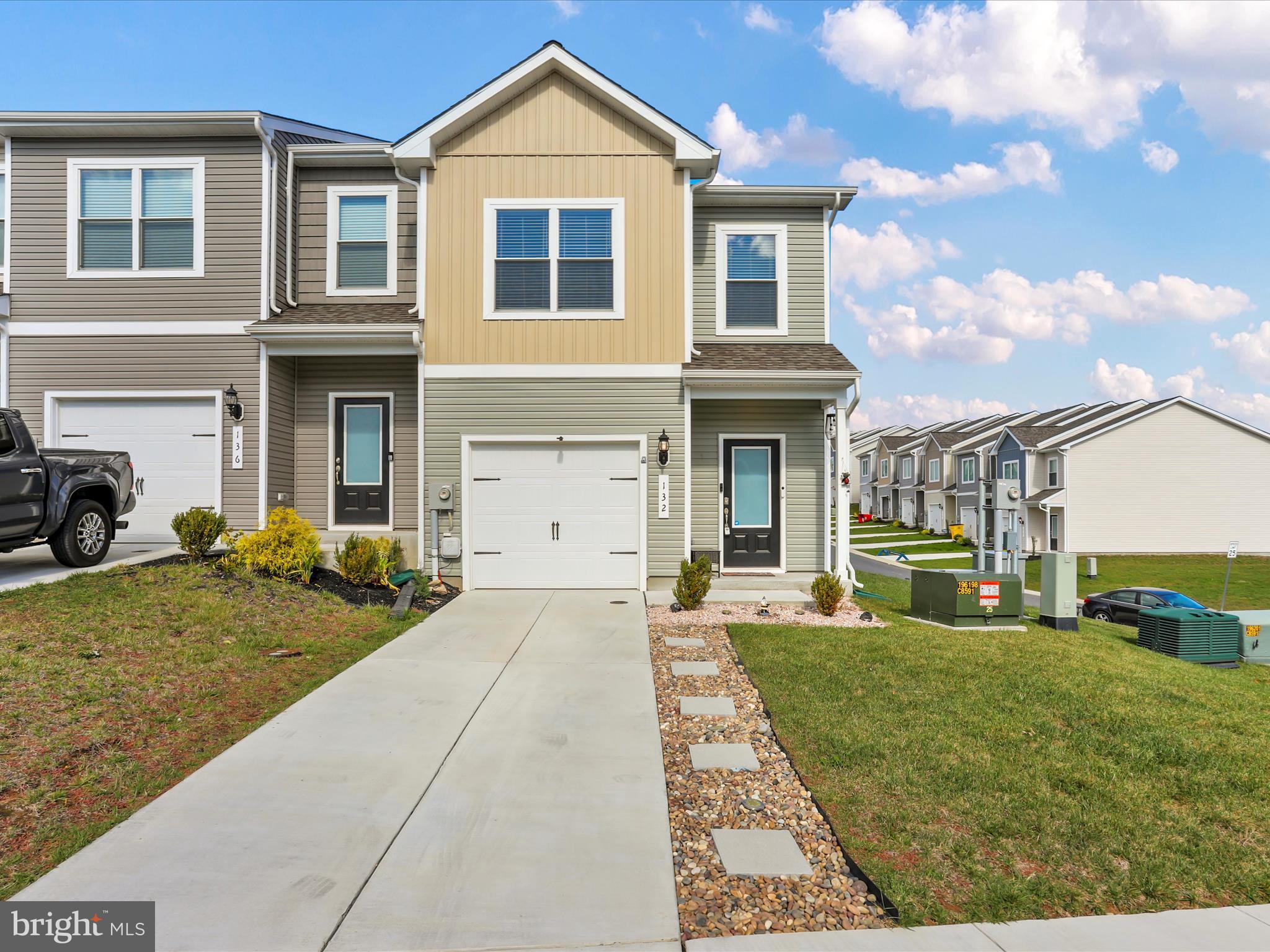 Modern comfort meets small-town charm in Falling Waters!

If you've been searching for a home that checks all the boxes, this is it!  This end-unit 3 bedroom, 2.5 bath townhome is only two years young and shines with stylish, modern finishes throughout.  You'll love the open-concept main level with luxury vinyl plank flooring, a bright kitchen with stainless steel appliances and a seamless flow to your massive outdoor space.  Step outside to the massive 16x16 deck and beautifully-designed patio area that's completely low-maintenance.  Gardening, grilling, relaxing by the fire pit and hosting unforgettable get-togethers make this outdoor space a dream!  Upstairs, you'll find laundry on the bedroom level, plus two comfortable additional bedrooms that share a full bath.  The primary suite feels like a true retreat-complete with a spacious walk-in closet, dual sink vanity, separate shower and your soaking tub.  Nestled in a friendly community just minutes from I-81, the Potomac River and the Maryland line, this home makes commuting a breeze and weekends even better.  If you love an outdoor space built for entertaining, don't wait....schedule your tour today!