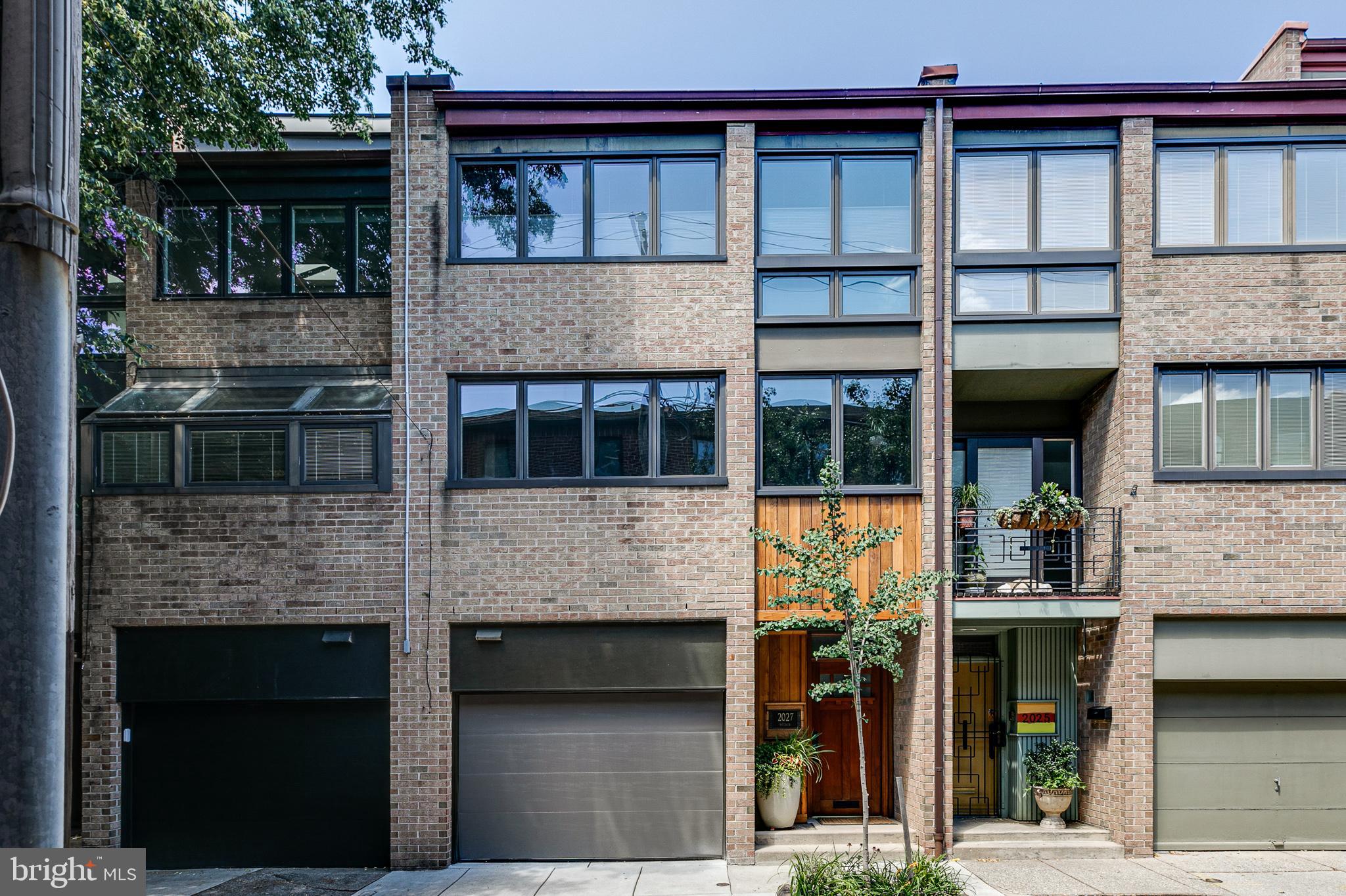 Incredible opportunity to be on a nice, clean, quiet street in Rittenhouse Square that backs up to Lombard Swim Club.  This is a beautiful light filled, split level style house with gorgeous woodwork, detailing, 3 story foyer with skylight, 2 large bedrooms, a large study, 2.5 baths and Garage parking!
1st floor/ lower level -  side entrance to good size garage with storage shelving, 1/2 bath with Corian countertop, custom vanity and stone floor. Lower level Study or Family room that can be a 3rd bedroom with two windows, wall to wall carpet and storage closet.
Living room level - Large open space with 13 foot ceiling, gas stove, fireplace, row of transom windows and slider to a beautiful IPE deck area with a pergola.
Kitchen / dining room level - dining room area overlooks the living room with a built-in-hutch and handrail with antique Japanese Ranma.  Kitchen - a wall of south facing casement windows, custom solid wood shaker style cabinets, peninsula seating, SubZero Frig, granite counters, Franke sink, Grohe faucet, dual fuel range and lots of counter top space.
3rd floor - spacious rear bedroom with large windows, wall of closets and cathedral ceiling in bedroom and in the ensuite bathroom which has a custom vanity with large linen drawers.
Front master bedroom with large walk in closet with wood organizers, skylit bright (access to roof through skylight) master bathroom with stall shower, double bowl sinks, Corian countertop and custom tile.  A wall of south facing  casement windows and ceiling fan.
The house is also equipped with a central vacuum system, solid oak floor throughout, security system, all windows have been replaced, 5 leaded glass windows in Frank Lloyd Wright pattern in living room, motorized clerestory windows in the 3rd floor hall and 2nd bathroom and upgraded electrical service to 200 amp panel and new breakers.

Don't miss this gem!