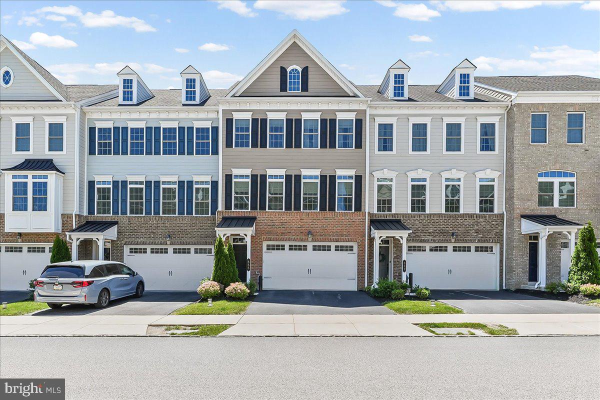 A lifestyle of luxury and convenience awaits in this beautifully appointed townhome located in the highly sought-after Great Valley School District. Situated on one of the few rows in the community that overlooks an open grassy lawn rather than a parking area, this home offers the perfect blend of comfort, style, and low-maintenance living.

The entry level features a private den with French doors, recessed lighting, a storage room, rear access, and entry to the attached two-car garage—ideal for a home office, media room, or flex space.

The sun-filled main living level boasts an open-concept layout with gorgeous hardwood flooring, neutral paint and recessed lighting throughout. At the heart of the home is a stunning chef’s kitchen featuring an oversized center island with seating for four, modern pendant lighting, stainless steel appliances, granite countertops, a custom tile backsplash, wall oven, abundant cabinetry, and a spacious walk-in pantry with custom shelving. The kitchen seamlessly connects the dining and living areas, creating an ideal space for entertaining. French doors from the living room lead to a maintenance-free deck, perfect for morning coffee or relaxing at the end of the day.

Upstairs, you'll find three generously sized bedrooms, including a luxurious primary suite with a spa-inspired bathroom featuring a double vanity, oversized shower, and a large walk-in closet complete with custom organization systems. Two additional bright bedrooms, a full hall bathroom, and a convenient laundry room complete the upper level.

Residents enjoy exceptional community amenities, including walking trails, parks, playgrounds, and a scenic 70-acre lake. The location offers unmatched convenience, with Wawa, Chesterbrook Preschool, and popular dining options just a short walk away. Additional nearby attractions include shopping, entertainment, major commuter routes, the PA Turnpike, and numerous everyday conveniences.

This exceptional home combines modern design, premium finishes, and an unbeatable location—offering the best of luxury townhome living.
