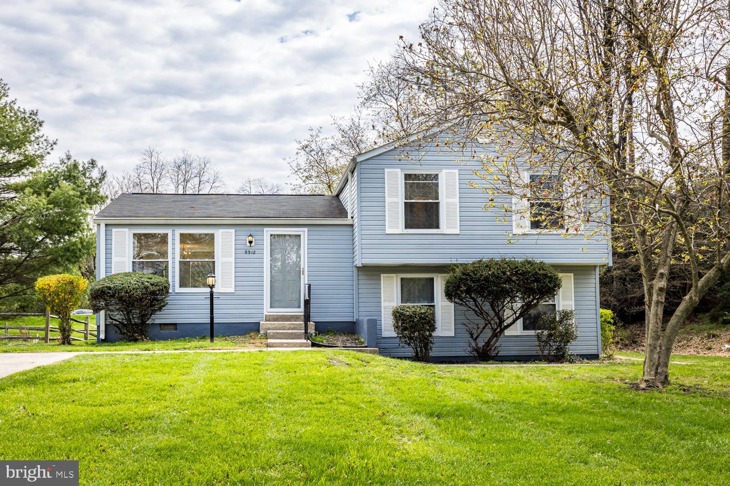 OPEN HOUSE CANCELLED. HOME IS UNDER CONTRACT.   Wonderful location on end of cul de sac, wooded area on side, backs to open green space.  Enjoy privacy and green space around home. Welcome to 6912 Bugledrum Way! Pride of ownership and lovingly maintained by original owner. This is your chance to update and refresh and make  this home your own. New step and small patio in back yard from dining room slider door.  Upon entry, you will flow directly into open living /dining combination with slider door to back yard.  Lots of natural light.  Kitchen off of dining room.  A few steps up and you will find three bedrooms, hall bath, and the primary bedroom with attached full bath.  The bathrooms were refreshed in 2021 along with a new ceramic tile kitchen floor.  The lower level provides additional living space along with an unfinished area with washer/dryer, furnace, water heater, and door to side yard. Enjoy all the amenities that Columbia has to offer - including pools, walking/biking trails, gyms, tot lots, and much more. Home warranty included.