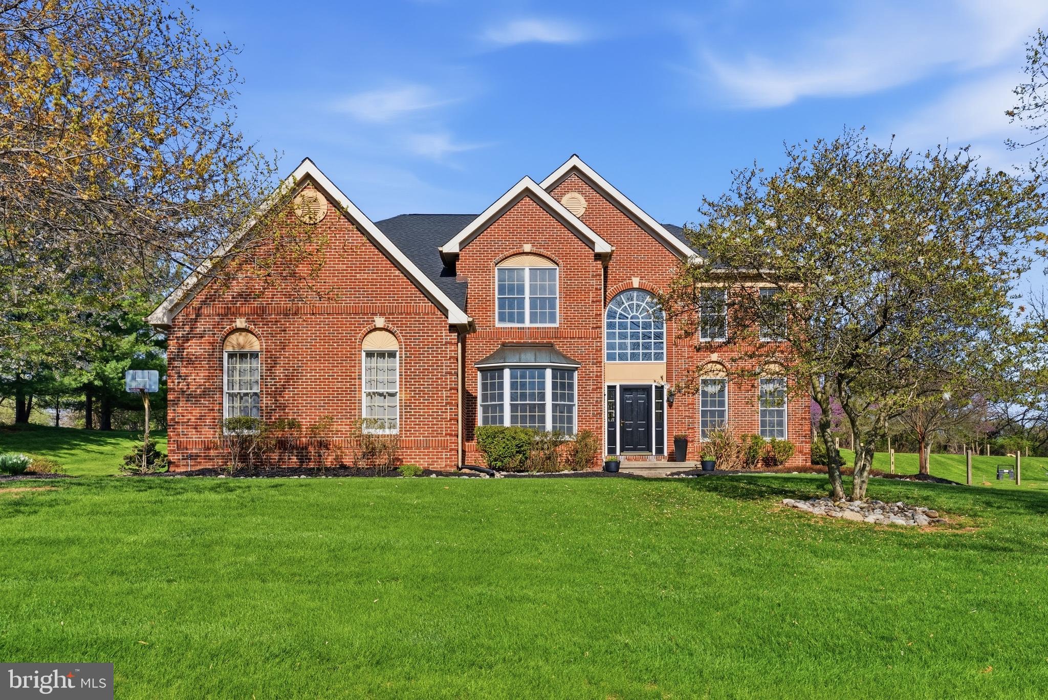Discover the perfect blend of sophisticated living and tranquil privacy in this stunning 4-bedroom, 3.5-bathroom Elkins Model, tucked away at the end of a quiet cul-de-sac in the highly sought-after Brandywine River Estates. Set on a wooded hillside where the East and West branches of the Brandywine River meet, this exclusive community of just 53 homes offers one of the most scenic settings in all of Chester County. Best of all, you enjoy this serene atmosphere while remaining just minutes from the vibrant shops and acclaimed dining of West Chester Borough. Step inside the dramatic two-story foyer and immediately experience the home’s open, airy floor plan. To your right, the formal living and dining rooms offer sophisticated spaces for gatherings, while to your left, a private home office provides a quiet sanctuary for work or study. The heart of the home is the expansive two-story family room, anchored by a breathtaking stone gas fireplace. Sunlight pours into this space through soaring windows, overlooking your lush, private rear yard and the adjacent 1+ acre of preserved open space, creating an inviting backdrop for daily life and entertaining. The gourmet kitchen serves as a seamless extension of the living space, featuring updated stainless-steel appliances, sleek granite countertops, and hardwood floors. From here, step out through the new slider onto your rear deck—a perfect spot for morning coffee or alfresco dining. Choose the front or rear staircase to ascend upstairs to the primary suite, your personal retreat, complete with a sitting area and an oversized walk-in closet. Enjoy the comfort of heated radiant floors in the beautifully updated spa-like en-suite bathroom, complete with a large soaking tub and a large shower. The secondary bedrooms are equally impressive, including a Jack-and-Jill suite and a private fourth bedroom with its own en-suite bath and a walk-in closet. Additionally, the home features a massive unfinished basement, offering abundant storage space and incredible potential for a custom home theater, gym, or game room. The 3-car garage adds to this home’s appeal. Meticulously maintained and move-in ready, this home features significant recent upgrades, including a new roof (2025), new front and rear doors (2026), and a new hot water heater (2026). With exterior construction free of stucco, you can buy with total confidence. Outside, you’ll enjoy access to nearly 65 acres of preserved open space and scenic walking trails throughout the community. Located within the award-winning West Chester Area School District, including Henderson High School, this property offers the rare combination of luxury, nature, and unparalleled convenience. Your new lifestyle awaits. Schedule your private tour today to experience the serene beauty of 291 Dressage Court in person.
