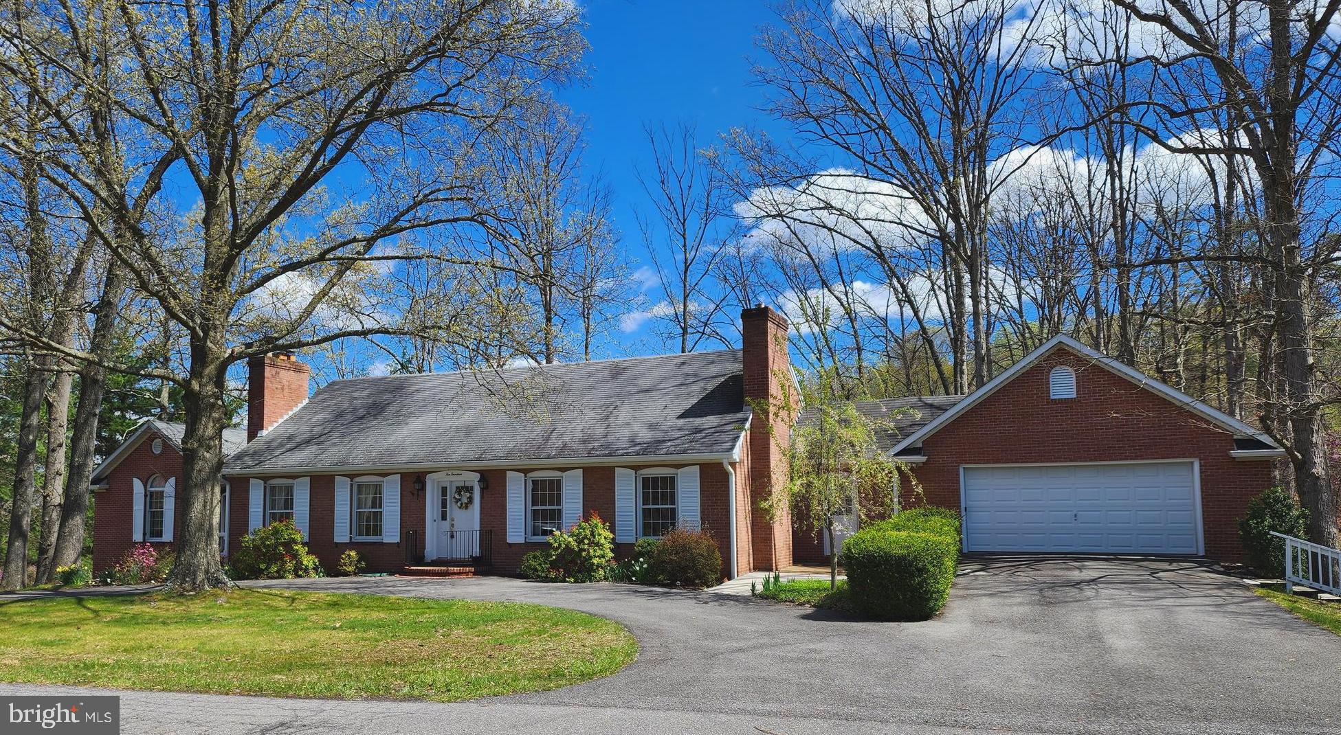 A RARE FIND! Charming all brick custom built  home is neslted in Cumerland and Mountain Side Maryland, as enter you are welcomed by a gracious staircase,  boasts 4,088 finished sf,  4 Bedroms, 5 baths, including owners suite with 2 baths and closets, total 4 Bedroms, 5 baths, eat-in kitchen, formal dining, hardwood and carpet floors, , lots of windows for natural lighting, 2 car garage on main level with a 3rd in the basement, all apliances convey, extra kitchen and bar with finished lower level, extended for guests, expansive outdoor spaces including deck and patio, plenty of storage, full basement, gas heat, central air, outdoor patio, rear back to trees.  Schedule your tour today!