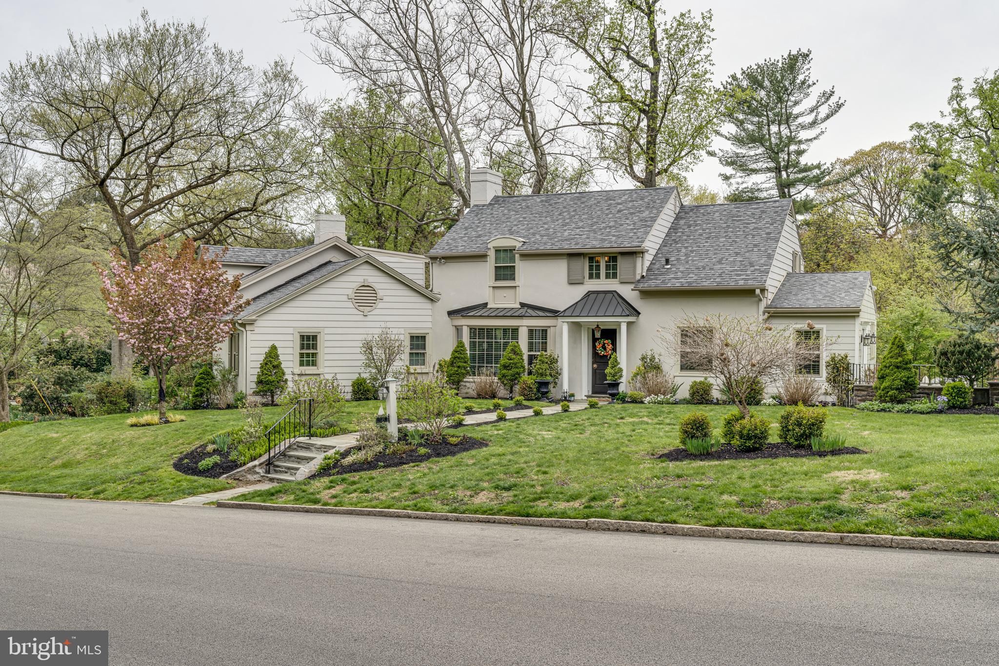 Welcome home to 301 McClenaghan Mill Road.  The minute you walk into this impeccably designed home, you will fall in LOVE! This picturesque 4 bedroom, 3 bath home is situated in coveted Northside Wynnewood boasting over 3,400 square feet on a sprawling .65 acre corner lot. As you walk down the beautiful walkway off of Montgomery School Lane, enter the home to see how the current owner has blended modern amenities with exceptional historic architecture.  To the right, you will find a completely renovated open concept gourmet kitchen looking out to a breathtaking view of the spacious backyard! The kitchen boasts soaring vaulted ceilings, white cabinetry, stainless steel appliances, brand NEW quartz countertops (being installed this week), and a custom wood island with gorgeous windows overlooking the  outdoor oasis.  This open concept area is complete with a large dining space, gorgeous light fixtures, custom designed ceiling and moldings, and abundant storage. To the left of the center hall you will enter a large living room with custom built in shelving and a stunning gas fireplace trimmed in custom tile work.  The first floor continues as you flow through a wide entryway to the original footprint of the home.  You will find a first floor bedroom (or home office), a new full bathroom with all the modern amenities, laundry room and another very large living area with ornate windows and details!  Stairs from this room lead to another bedroom and bathroom. The main second floor includes a master bedroom with a master bathroom.  The second floor hosts another bedroom with ample closet space.  Hardwood floors throughout the home.  The fully fenced in backyard is perfect for everyday living and is an entertainer’s delight! Enjoy the outdoor gazebo from warm Spring Summer nights to cool Fall evenings.  The backyard is truly your own private oasis!  The basement is perfect for storage, or can be turned into a playroom or home office space. The basement leads directly to the THREE car garage.    This home has been meticulously maintained and renovated by its current owner for 12 years. 301 McClenaghan Mill Road is located in an ultra convenient location with just a short walk to Suburban Square, Trader Joe’s and Whole Foods. Plus, this location is just a little over a mile to two different SEPTA stations for a short ride to Center City! Situated in the Lower Merion High School Choice area, 301 McClenaghan Mill Road is a special GEM that you will not want to miss!