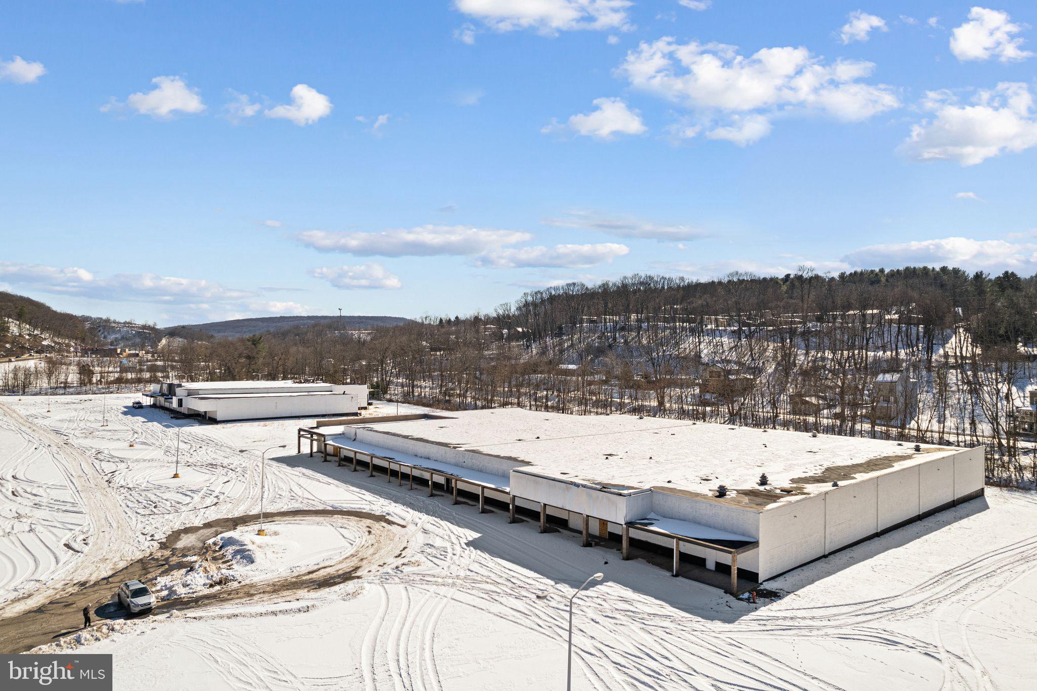 Located just outside of Shamokin along a bustling strip of various businesses, this expansive property offers a prime opportunity for your business. With 100,000 square feet of space on 17 acres, this property boasts industrial bones that can be seamlessly transformed into a modern retail space. The ample square footage and strategic location make it ideal for a wide range of commercial ventures. Don't miss the chance to establish your business in this versatile and conveniently located property.