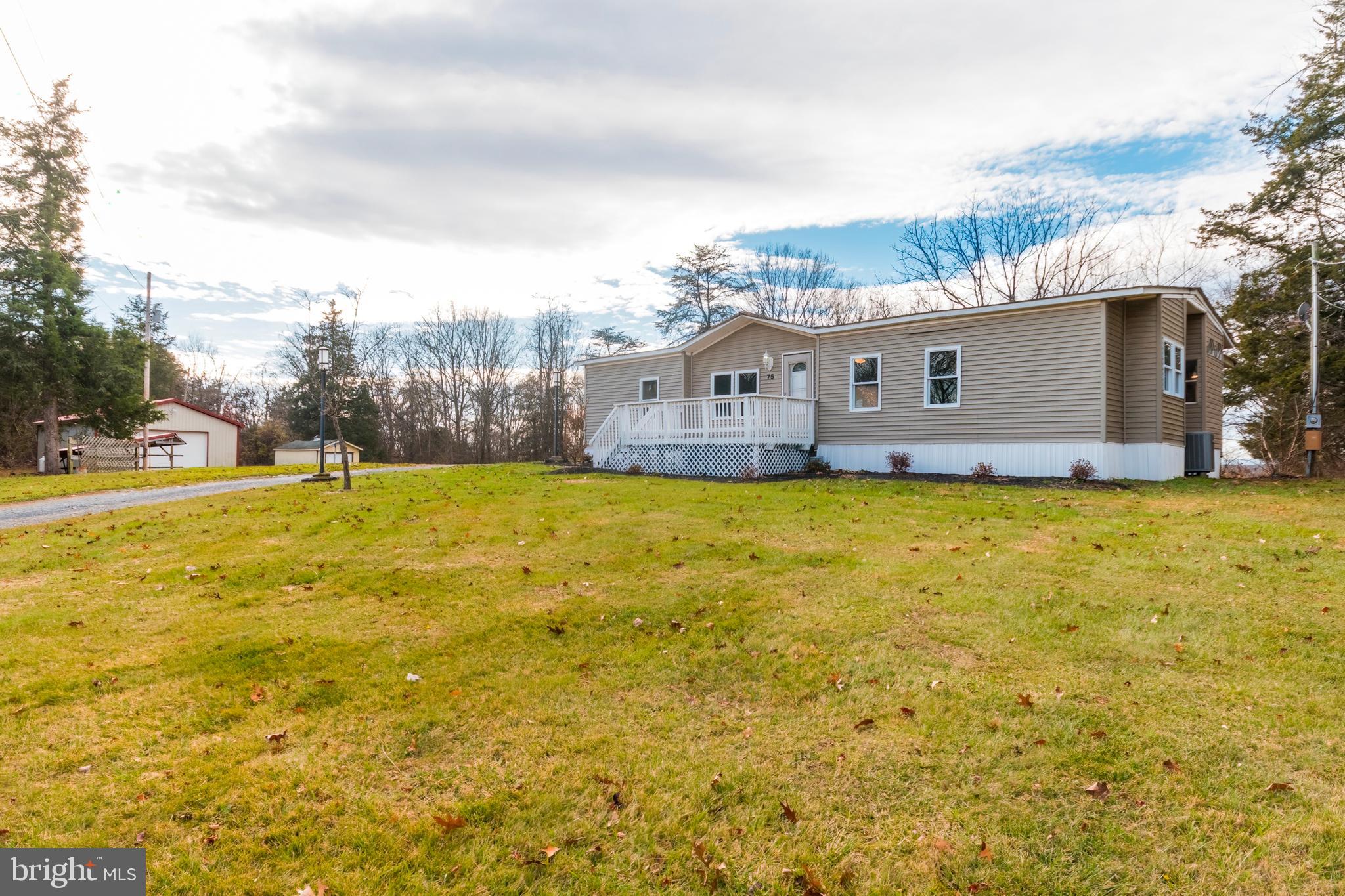 One of a kind property comes with two lots and over 5.5 acres with river frontage.   Home boasts a large 2 car detached workshop/garage and multiple other sheds and outbuildings. Workshop is heated and cooled and perfect for a mechanic to run a  small business.  Very private setting with no HOA. Enjoy fishing on your own river or four wheeling in your own backyard.  Home features 3 bedrooms and two bathrooms with new kitchen, new flooring, new paint, new hvac system and new appliances.