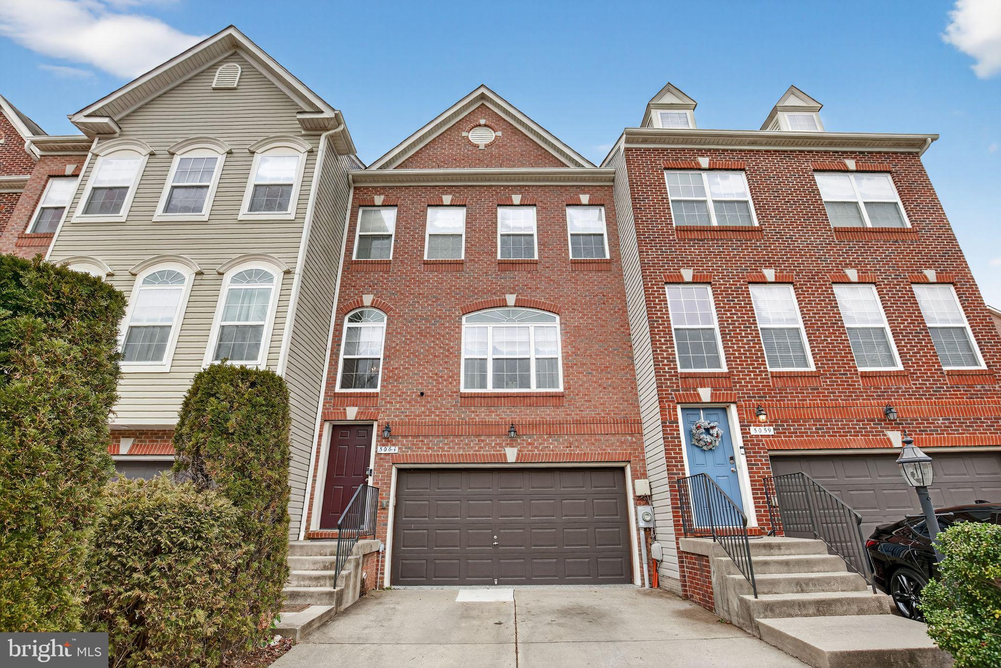 Fantastic, like-new, completely move-in-ready three-level townhome awaiting its next owner! The entry level features an oversized two-car garage with finished walls and flooring, creating the perfect space for parking, storage, a workshop, or an incredible hobby room. Inside, you'll find a spacious recreation room with plenty of space for oversized furniture, game nights, movie marathons, or cheering on your favorite team. A convenient half bath and walkout access to the backyard complete this level. Step outside to enjoy the fully fenced backyard featuring a six-foot white privacy fence and a flat yard ideal for pets, play, or outdoor entertaining.

The main level offers an expansive family room enhanced by new recessed lighting and abundant space for large-scale furnishings. Whether you envision a formal living area, media room, or gathering space, the possibilities are endless. The beautifully remodeled kitchen showcases quartz countertops, custom cabinetry, designer backsplash, premium LG stainless steel appliances, upgraded fixtures, and luxury vinyl plank flooring. Adjacent to the kitchen is a generously sized dining area with direct access to the Trex deck featuring vinyl railings—perfect for grilling, relaxing, and extending your living space outdoors.

Retreat to the upper level where you'll find three spacious bedrooms and two full bathrooms. The impressive owner's suite features soaring cathedral ceilings, a walk-in closet, and a luxurious en-suite bath complete with a dual-sink vanity, ceramic-tiled shower, and separate soaking tub. Two additional well-sized bedrooms offer ample closet space and share a large hall bathroom.

This exceptional home combines modern upgrades, generous living spaces, and true move-in-ready convenience. Schedule your tour today!
