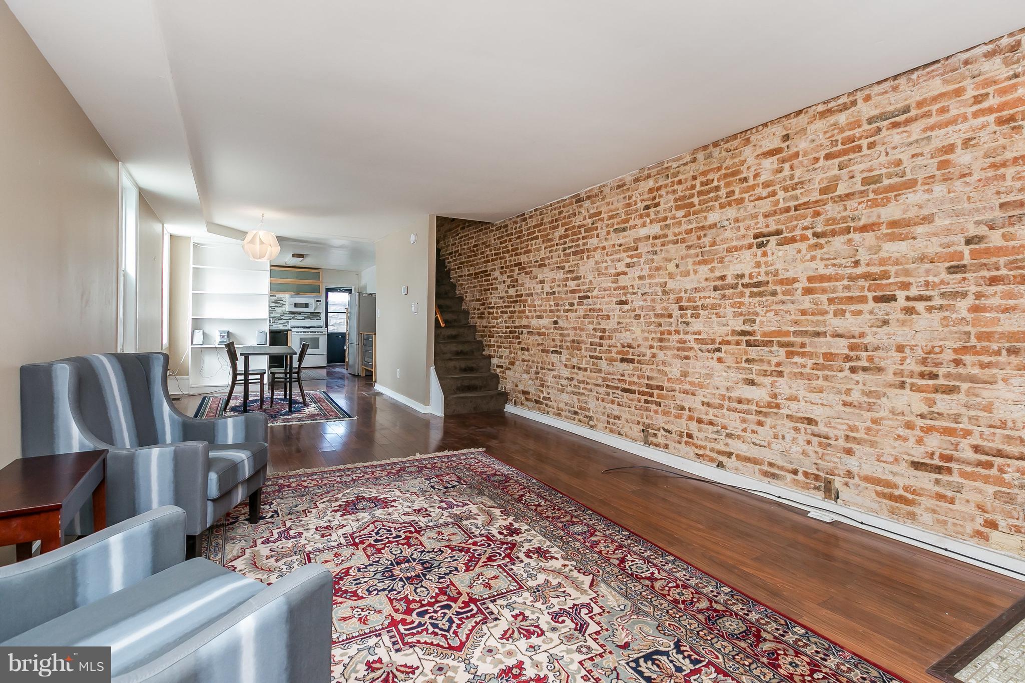 GARAGE w/automatic door opener**Baltimore's Hidden Gem**Unbelievably bright end of group * Chef's kitchen w/ Ikea cabinets, glass ceramic tile accents & energy star appliances. Energy efficient windows many w built-in blinds. High efficiency HVAC & spray foam installation. Exposed brick walls, recessed lights and all  within 1.8 miles from St Agnes Hospital with easy access to downtown, I95 & 695.