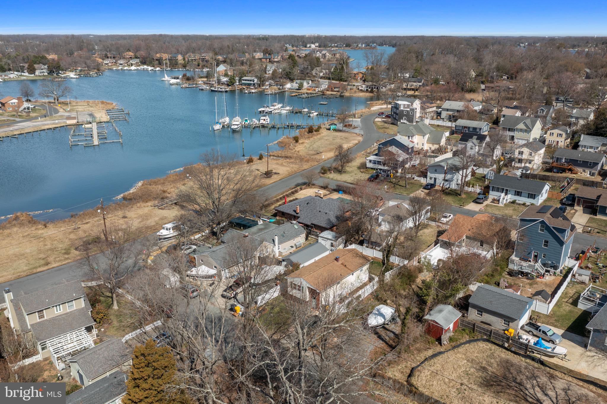 Fantastic buildable lot just two houses from the water. Here is your opportunity to build your perfect home! Outstanding lot with water view in amenity rich, water privileged Woodland Beach.  Lot is cleared and ready to build. New home should have a nice water views and great sunsets!  Woodland Beach has 3 miles of shoreline bounding Almshouse Creek and Glebe Bay with  five sandy beaches each with swimming platforms, crabbing and fishing piers, boat and kayak/SUP launches, parks and playgrounds, a Community Center, private security and low cost boat pier and kayak rack rentals . Blue ribbon award winning schools, walk to shopping, dining, and schools. Quick access to downtown Annapolis and close to commuter routes to DC and Baltimore!  An ideal location for year round living or a vacation home without going over the Bay Bridge!