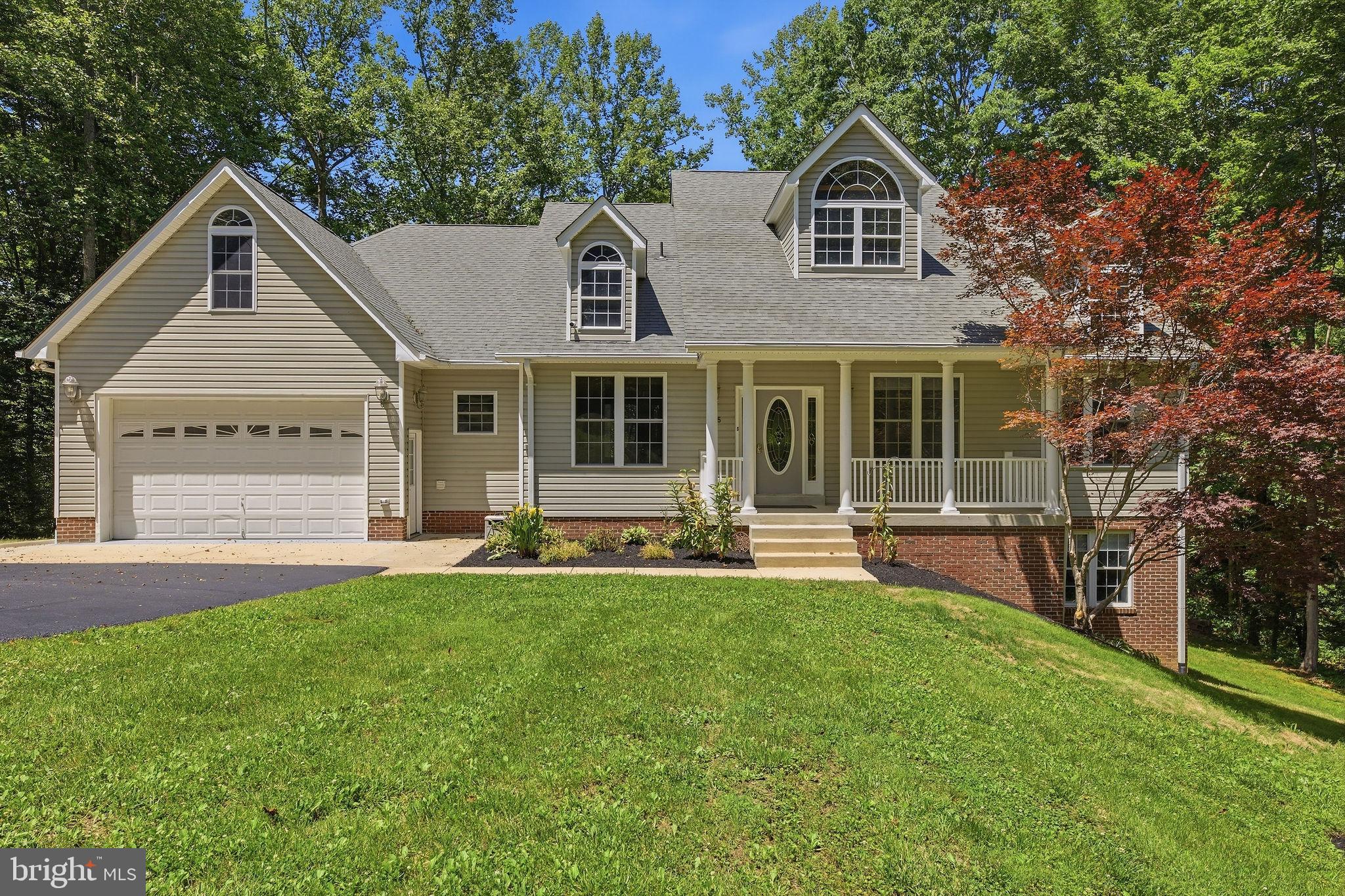 Tucked away on 2 private acres and surrounded by mature trees, this exceptional custom rambler offers the perfect blend of comfort, space, and peaceful country living. With over 5,100 square feet of finished living space, this meticulously maintained home provides room for everyone while still feeling warm and inviting.
Designed with both everyday living and entertaining in mind, the open-concept floor plan features elegant tray ceilings, a propane fireplace, and expansive living spaces filled with natural light. The spacious kitchen serves as the heart of the home, showcasing granite countertops, stainless steel appliances, abundant cabinetry, and generous prep space for gathering with loved ones.
The main level offers the convenience of one-level living with three bedrooms and two-and-a-half bathrooms, including a spacious primary suite. Every detail has been thoughtfully cared for, creating a home that is truly move-in ready.
Step outside onto the rear deck and take in the peaceful views of the woods and the stream that meanders through the  back of the property. Whether you're enjoying your morning coffee, hosting a cookout, or simply unwinding after a long day, the natural setting creates a sense of privacy and tranquility that is hard to find.
The fully finished walkout lower level expands your living options with a large recreation room, game room, surround sound system, additional living area, fourth bedroom, and full bathroom. It's the perfect space for entertaining, accommodating guests, or creating a private retreat. Walk directly out to the patio and backyard where nature becomes an extension of your living space.
Need additional flexibility? The finished room above the garage is ideal for a home office, gym, hobby room, media room, or extra storage. The fully finished garage features durable epoxy flooring, while abundant storage throughout the home ensures everything has its place.
Additional highlights include a 4-ton HVAC system with three separate zones, architectural shingles, gutter guards, and no HOA. Located within the highly sought-after Huntingtown High School district, this property offers the best of both worlds—peaceful surroundings with convenient access to Route 4, shopping, dining, and everyday amenities.
For buyers seeking space, privacy, quality craftsmanship, and a connection to nature, this remarkable property delivers a lifestyle that is difficult to match.