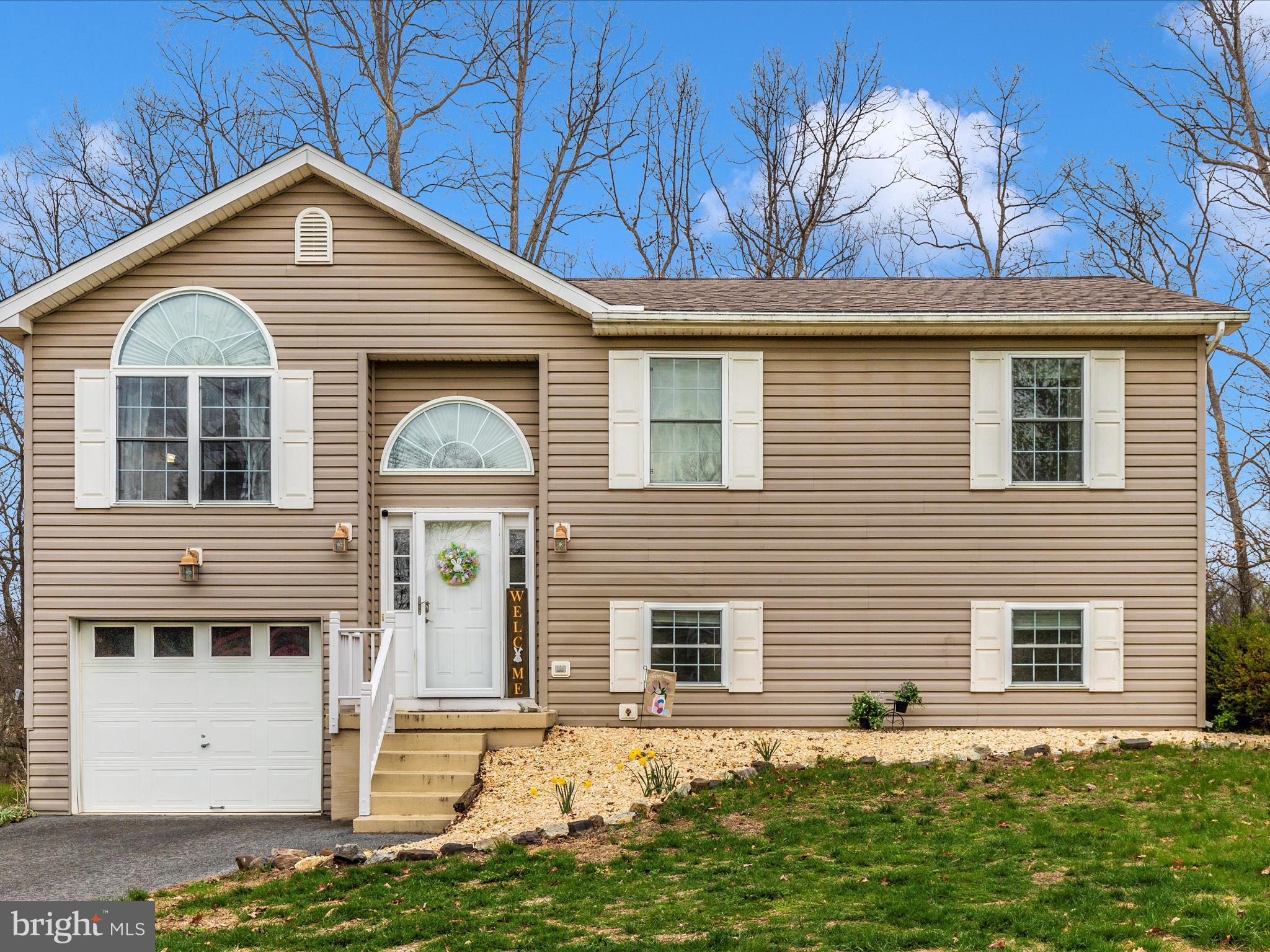 Welcome to this charming split-level family home nestled on a spacious .53-acre lot, backing up to a serene backdrop of trees. This delightful residence features three comfortable bedrooms and two full baths, finished basement with a bonus room that could be converted into a 4th bedroom, making it perfect for families or those seeking extra space.   Step inside to find a bright and inviting main level adorned with new luxury vinyl plank (LVP) flooring, open kitchen with updated modern appliances (2023) combining style and durability. The home boasts a 1-car garage, offering convenient parking and storage options.   Relax on the Deck off the rear of the home overlooking the woods and enjoy the privacy.  Recent updates include a new architectural shingle roof (2023) ,  brand-new HVAC and hot water heater systems (2024), ensuring peace of mind and energy efficiency.    Located in a lovely neighborhood, this home offers a perfect blend of comfort and tranquility, ideal for creating lasting memories. Don’t miss the opportunity to make this wonderful property your own!