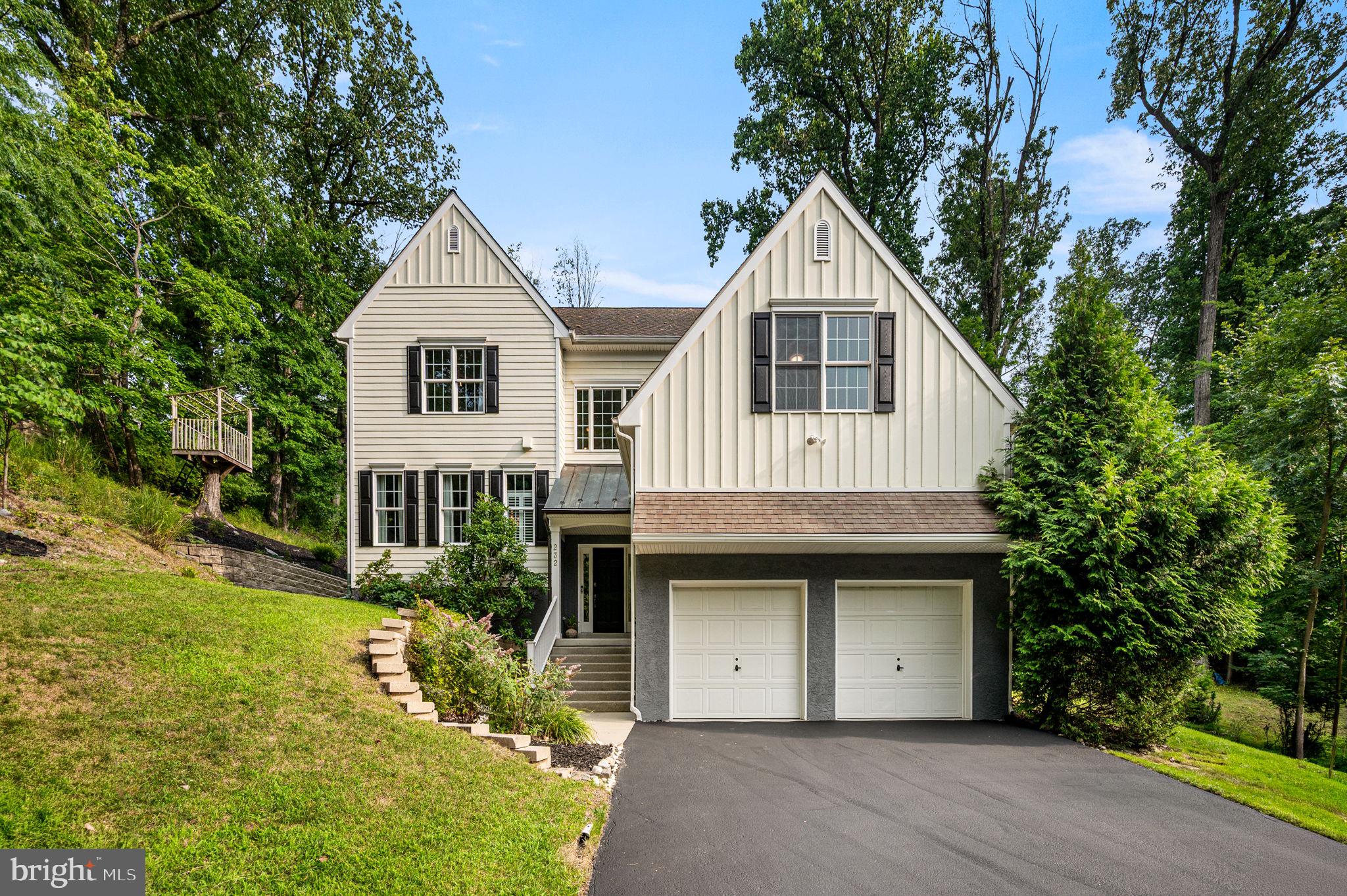 This magnificent hillside home was custom crafted on a wooded lot in the highly sought after Valley Hills neighborhood with attention to detail and a unique layout. It is an immaculate, move in ready and pristine condition inside and outside. The home is nestled on just over a third of an acre lot with beautiful views and natural wooded buffers. Enter through the charming and inviting covered front porch to the stunning two-story foyer showcasing the split staircase, gorgeous hardwood flooring and a stately second story window providing tons of natural daylight. Throughout the home you will find an open floor plan, 9' volume ceilings, sun filled rooms, and rich hardwood flooring. The fantastic family room features built in bookshelves, with a floor to ceiling gas stone fireplace and a raised hearth. There is also a convenient beverage nook. The wall of windows provides the peaceful wooded vista and an abundance of natural light. The chef's gourmet kitchen designed for entertaining is amazing with vaulted ceilings, skylights, lots of natural wood raised panel cabinetry with crown molding, including a large pantry, granite counters,  center island with bar height seating and premium stainless steel appliances. The kitchen side door leads to the 26' low maintenance composite deck ready for outside dining and entertaining or simply relaxing under the stars in the newer jacuzzi-spa hot tub. The gracious and elegant dining room has plenty of space for large family gatherings on the holidays, and offering lovely views of the tranquil backyard. The luxurious living room is simply breathtaking, and can be used as a guest bedroom with an adjacent completely custom full bathroom that is conveniently located on the main living level of the home. The lavish main bedroom suite features duel walk-in closets and a sumptuous main bathroom featuring  a double vanity, separate opulent shower and a stand-alone soaking tub. The laundry room with the new dryer and a washer set on pedestals is located  on the upper level for accessibility and convenience. There are three additional spacious bedrooms, a splendid hall full bathroom, and a large separate walk-in storage room. The enormous walk-out basement is currently being used as a professional home office. It has so much potential with three separate massive areas that can become a fully equipped workout wellness retreat room, media entertaining lounge, and a large playroom with tons of extra storage space. The possibilities are limitless with this gigantic lower level. The attached two car garage with a brand new asphalt driveway, also has plenty of storage space. The home is fitted with energy-efficient two-zone heating and central A/C systems, a home security system, and an integrated whole-house backup generator. The property has extensive hardscaping and landscaping with beautiful gardens. It is situated within the highly sought-after, top-ranked Tredyffrin-Easttown School District. It is within walking distance of Friendship Park and the Paoli train station offering easy commuter access to Philadelphia, New York, and Washington D.C. It also sits just minutes away from Valley Forge National Park, Airdrie Forest Preserve, King of Prussia Mall, and local Main Line shopping and dining. Don't miss the opportunity to view this truly spectacular home! 
Stop by the Open House - Saturday - 7/18 between 11:00am & 1:00pm.
Check out the icon links above for the 3D Walkthrough Tour & Video!