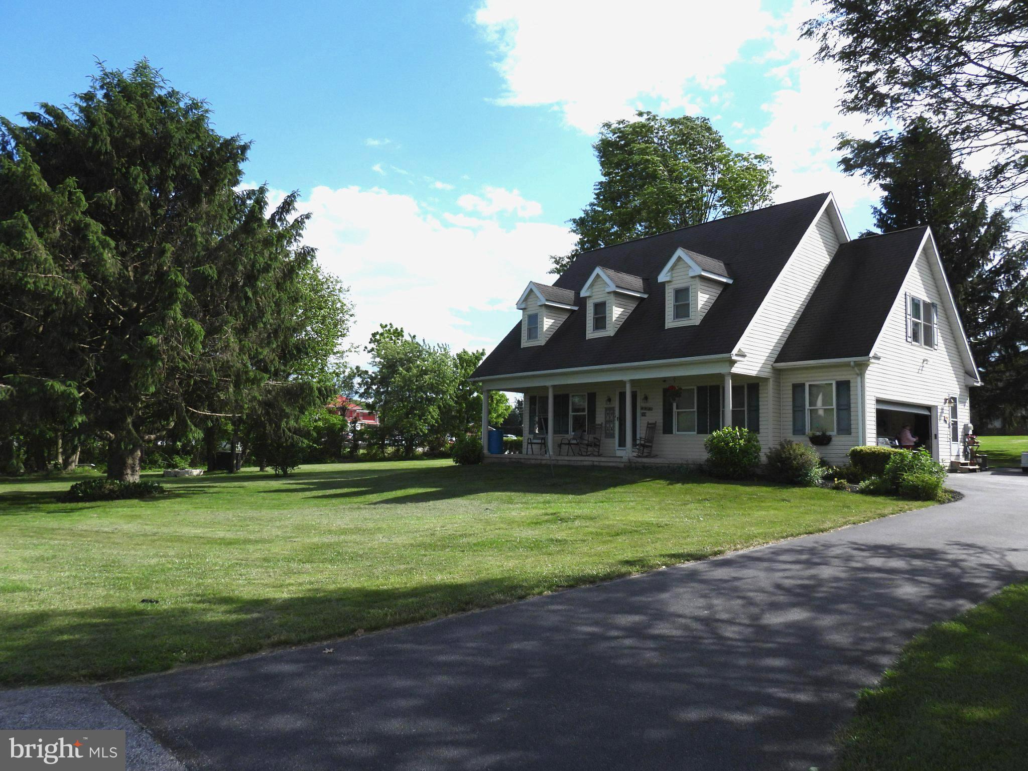 This charming Cape Cod home sits at the end of a dead-end street nestled in the heart of Red Lion Boro and offers a perfect blend of comfort and style. With over 2,000 square feet of thoughtfully designed living space, this beautiful home features three inviting bedrooms and two and a half bathrooms, ensuring ample room for relaxation and privacy. Step inside to discover a warm and welcoming interior making you feel at home right away. The kitchen is equipped with plenty of beautiful cabinets and a six-burner gas stove for all those special meals you crave. breeze. Retreat to the master suite, complete with a luxurious soaking tub and two generous walk-in closets, providing a serene escape at the end of the day. Recessed lighting and ceiling fans throughout enhance the inviting atmosphere. Outside, the property boasts a beautifully landscaped 0.72-acre lot, featuring exterior lighting and an outbuilding for additional storage or hobbies. The attached side-entry garage offers easy access and ample parking with an asphalt driveway. This home is not just a place to live; it's a sanctuary where memories are made. Experience the perfect blend of comfort, style, and functionality in this delightful property. Don't miss the opportunity to make it your own!