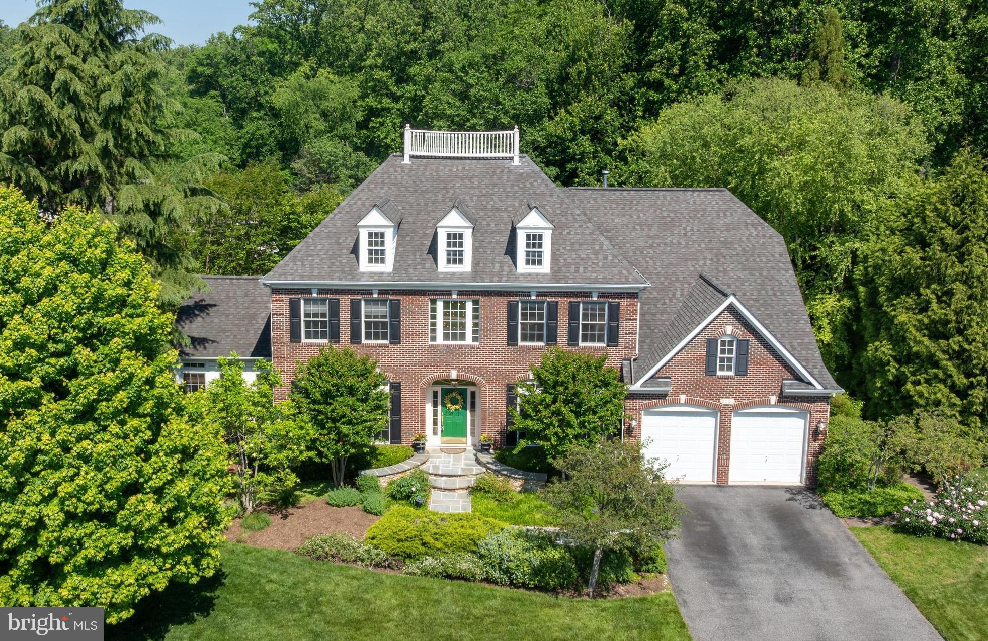 Outstanding opportunity to own in Jenifer Ridge, one of the most desirable communities in Baltimore County. This 5‑bedroom, 4.5‑bath brick colonial sits on a beautifully landscaped, flat lot backing to trees for exceptional privacy. The owners have meticulously maintained the home over the years. The open‑concept chef’s kitchen features cherry cabinetry with glass displays, Quartz Caesarstone counters, Marble Manor Calacatta glossy ceramic subway tile backsplash, a deep undermount double stainless steel sink, Sub‑Zero double‑door refrigerator, Wolf stainless steel range hood, Wolf double ovens, an upgraded stainless steel dishwasher with warranty, a hanging pot rack over the large center island, recessed lighting, a pantry, and a separate food prep counter and sink off an adjoining hall. The large kitchen table area flows to a family room with a floor‑to‑ceiling stone hearth with gas fireplace, tray ceiling, recessed lighting, and an integrated surround‑sound speaker system. A convenient half bath is located just off the family room. Adjacent to the large living room is a conservatory/sunroom—perfect for morning coffee or evening wine—featuring three walls of windows with transoms, custom window treatments, and its own HVAC unit for year‑round comfort. This generous space can serve as an office, playroom, game room, or true conservatory. A private main‑level office with built‑in shelving and desk provides an ideal work‑from‑home setup. The two‑story foyer leads to the second level, where you’ll find a spacious primary suite with a sitting room, tray ceiling, two walk‑in closets, and a private ensuite bath with jacuzzi and upgraded Grohe shower fixtures. Three additional bedrooms and two full baths complete the upper level—one hall bath and one ensuite in the fourth bedroom. The upstairs HVAC system (Unit 3) was upgraded in December 2023 to a premium energy‑efficient Carrier Comfort system. The impressive lower level, with above‑ground windows and French‑door walkout to the patio, includes a large recreation room, a spacious fifth bedroom with full bath, new wall-to-wall carpeting in 2020, washer and dryer, additional refrigerator and freezer, a bonus room, and two sizable storage rooms. A 75-gallon energy efficient, natural gas water heater was upgraded in 2021. A radon mitigation system is included. The oversized deck off the kitchen functions as an additional outdoor living room, complete with a seasonal waterproof awning ideal for summer entertaining. The backyard is truly spectacular—private, flat, and serene—with a hardscaped stone outdoor kitchen, patio with pergola, fountain, garden arbor, professionally landscaped grounds with irrigation and lighting, and a separate stone firepit patio. Perfect for gatherings, yard games, and gardening. Tree house conveys AS IS. This home offers exceptional features, flexible spaces, and a rare level of privacy. Don’t miss this opportunity to live in rarely-available Jenifer Ridge.