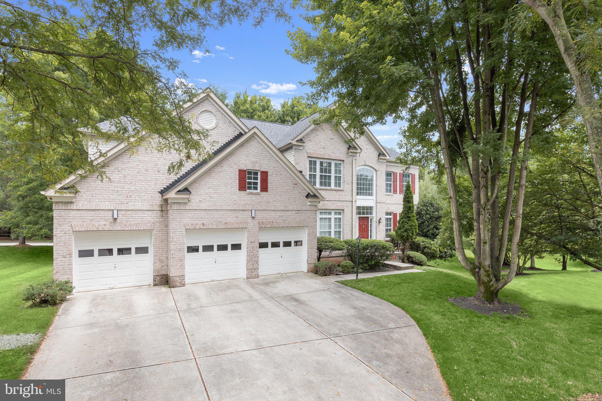 Welcome to 6111 Rippling Tides Terrace, a stately Colonial gracefully positioned on a peaceful cul-de-sac in the heart of the highly sought-after River Hill community. Showcasing timeless elegance, this exceptional residence offers rich hardwood floors, classic moldings, soaring ceilings, and sun-filled interiors designed for both everyday living and grand entertaining. A dramatic two-story foyer is flanked by formal living and dining rooms, while the living room provides access to a private office through French doors, creating an ideal work-from-home retreat. At the heart of the home, the expansive eat-in kitchen is thoughtfully appointed with a center island featuring a cooktop, wall oven, sleek stainless steel appliances, 42-inch cabinetry, a planning station, butler's pantry, and a bright breakfast room with access to the deck. The impressive two-story family room is anchored by a cozy fireplace and hardwood floors, offering an inviting gathering space. A laundry room, powder room, and access to the attached three-car garage complete the main level. Upstairs, the luxurious primary suite is a true sanctuary featuring a private sitting room with a striking peninsula fireplace, an expansive walk-in closet, and a spa-inspired en-suite bath with separate vanities, a soaking tub, and a glass-enclosed shower. Three additional generously sized bedrooms and a full bath complete the upper level. The finished lower level expands the living space with a spacious recreation room, a fifth bedroom with built-in shelving and French doors, two versatile bonus rooms ideal for a home gym, theater, or hobby space, a full bath, and abundant storage. Outdoors, enjoy relaxing or entertaining on the spacious deck overlooking the beautifully landscaped surroundings. Perfectly located just moments from River Hill's scenic trails, award-winning schools, community pools, fitness centers, shopping, dining, and major commuter routes including MD-32, MD-29, and I-95, this remarkable home offers convenient access to Baltimore, Washington, D.C., Rockville, and Annapolis. A rare opportunity to experience luxurious living in one of Howard County's most prestigious communities.  Some photos have been virtually staged.