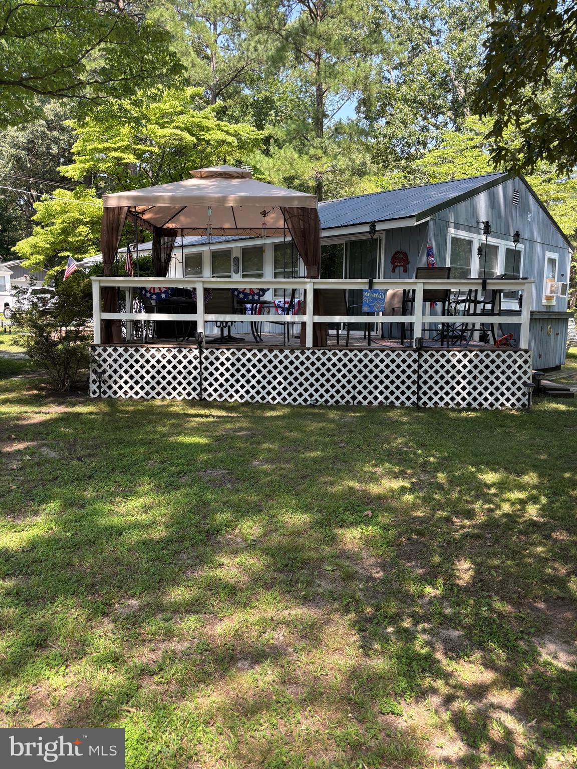 Move right into this  maintained 3-bedroom carriage home in the Riverdale Park community, nestled in the Oak Orchard area of Millsboro. Whether you’re searching for the perfect beach getaway or a full-time coastal residence, this move-in ready home offers comfort, value, and an unbeatable lifestyle.

Situated on a premium lot with a spacious, beautifully maintained fenced backyard, you’ll enjoy plenty of room to relax, entertain, or let pets play. Step outside onto the deck and enjoy your own private outdoor retreat. Inside, the home has started to be updated with a completely remodeled primary bedroom, a dedicated laundry room, upgraded electrical service with a new circuit breaker panel, and a durable metal roof installed approximately five years ago. The home is partially furnished, making your move even easier.

As an added bonus, this property includes a 2007 Tahoe pontoon boat that runs great and was reupholstered just a few years ago—perfect for enjoying all the nearby waterways and making the most of coastal living.

With a low annual land lease of just $4,613 for this premium lot, this property offers exceptional value in a sought-after waterfront community. If you’re looking for a home that needs a little updating and love but is still turnkey with incredible outdoor space and a bonus pontoon boat included, this is one you won’t want to miss. Schedule your private showing today!

BEING SOLD AS IS WHERE IS 

subject to park approval