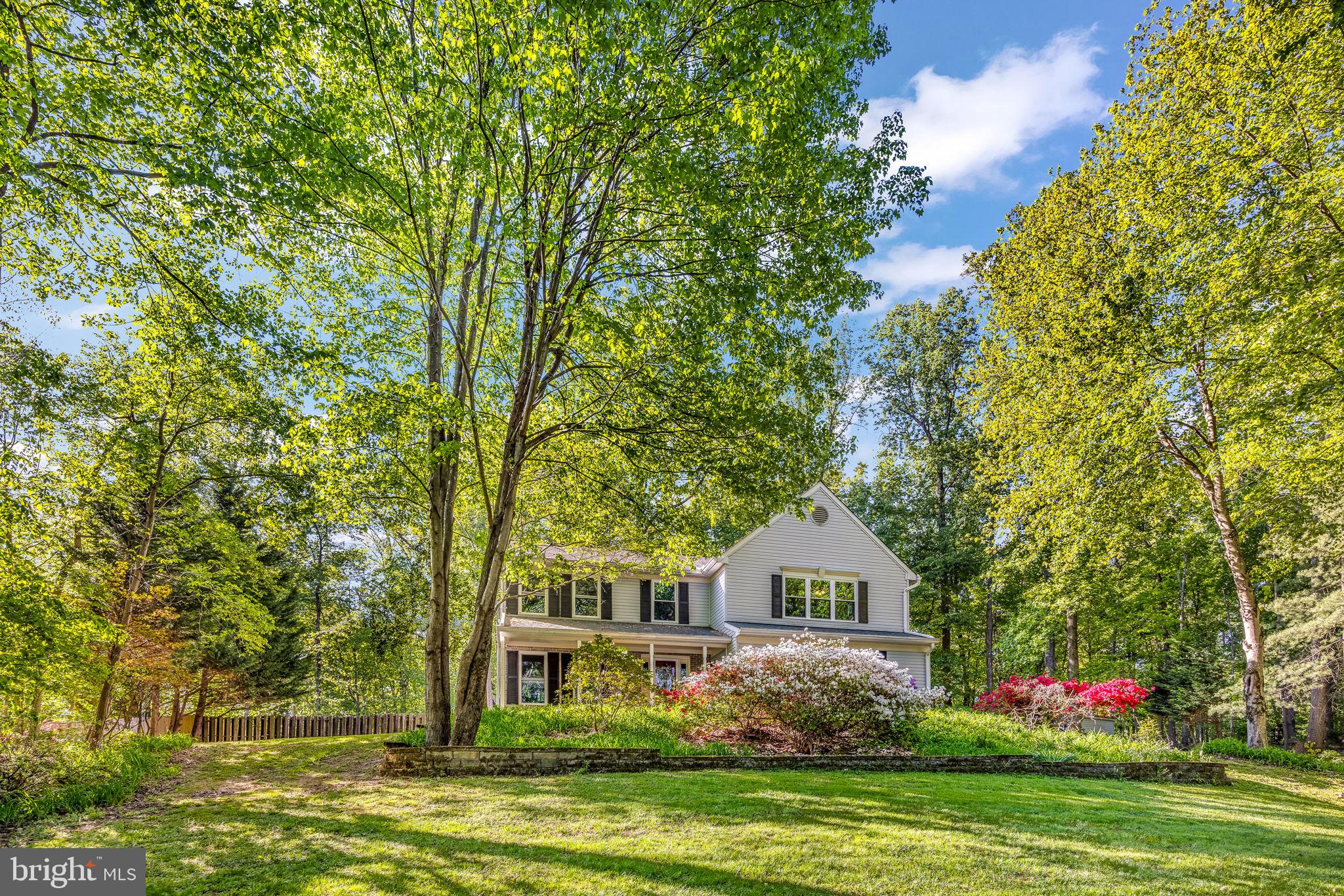 Nestled in the charming Gingerwood community and sitting on 1.6 acres of land, this stunning Colonial home offers a perfect blend of comfort and style. Most windows replaced in 2023! Entire main level is all hardwood flooring! With 4 spacious bedrooms and 3.5 bathrooms, this residence boasts a generous 3,504 sq. ft. of thoughtfully designed living space, ideal for both relaxation and entertaining. Step inside to discover a warm and inviting interior featuring a traditional floor plan that flows seamlessly from room to room. The Kitchen, renovated in 2023 is adorned with new cabinets, new granite countertops, and new appliances.  There is new tile backsplash and recessed lighting. The eat in Kitchen is perfect for casual meals, while the dining Room sets the stage for more formal gatherings. Cozy up by the gas fireplace in the living room, creating a perfect ambiance for chilly evenings. The primary suite offers a private bath, ensuring a tranquil retreat at the end of the day. The fully finished basement, complete with a walkout entrance, provides additional living space, perfect for a home office, playroom, or entertainment area.  Full Bath renovated in 2025, has LVP flooring and a barn door. Outside, the expansive 1.6-acre lot backs to serene trees, offering a peaceful escape from the hustle and bustle. Enjoy the outdoors on the spacious deck or the new stamped concrete patio completed in 2022. The property also features secure storage and a shed for all your gardening tools and outdoor equipment. With ample parking options, including a 2-car attached garage and driveway space for six, convenience is at your fingertips. This home is not just a place to live; it’s a place to create lasting memories. Experience the perfect blend of comfort, style, and nature in this delightful residence. Other upgrades include a new septic tank and field in 2024 and new attic insulation in 2023! Sprinkler system "As Is"