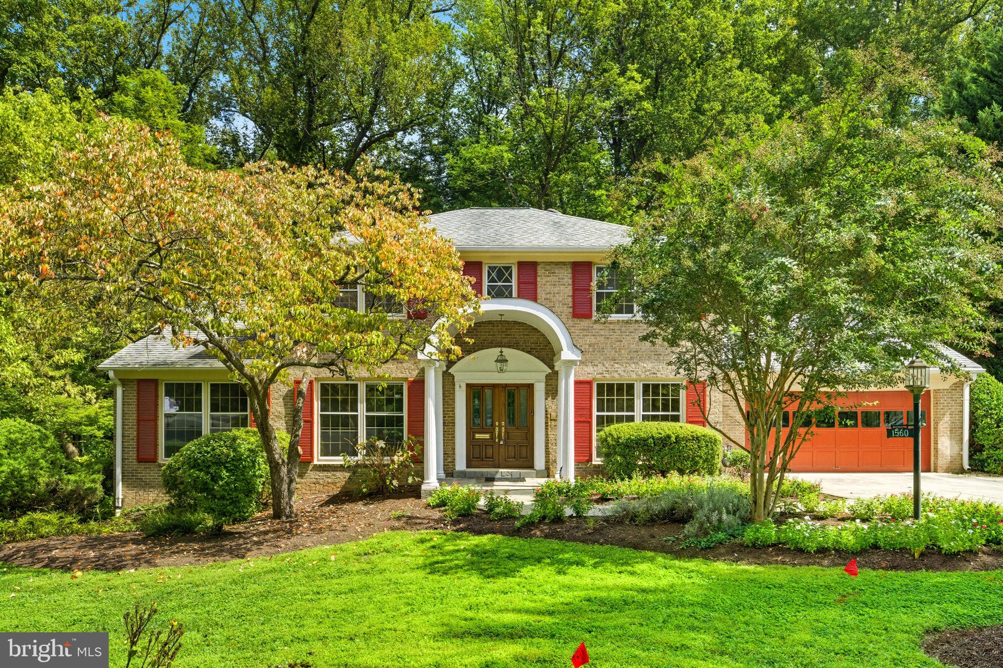 Open house this Sunday, 2-4pm!  All-Brick Colonial Backing to Parkland in Exclusive McLean!  Set on a tranquil, tree-lined street in one of McLean’s most visually beautiful neighborhoods, this stately all-brick center-hall colonial offers timeless elegance and modern comfort. The property enjoys a premier lot backing to lush parkland with direct access to trails leading to the community pool and tennis club.  Inside, the home blends classic architecture with thoughtful updates. The Living Room features beautifully finished oak floors, and the expanded and remodeled kitchen is a chef’s dream, featuring a 48-inch Viking range with griddle and hood, paneled Sub-Zero refrigerator, oversized island with prep sink, abundant cabinetry, and extensive counter space. The sunlit breakfast room with bay window and gas fireplace creates a warm gathering space overlooking the trees and parkland. The inviting family room boasts refinished pegged hardwood floors, a second gas fireplace, and French doors opening to the patio. Upstairs, refinished hardwood floors flow throughout four bedrooms, including a spacious primary suite with new premium carpeting, two oversized walk-in closets, and a European themed bath. The finished walk-out lower level boasts an enormous Recreation Room, Home Office, and a fifth bedroom, full bath, cedar closet, and Storage Room. Additional highlights include a main-level laundry/mudroom with cabinetry and generous storage, two-car garage with Garage-Tek style organization system and epoxy floors. The large, screened porch with stone floor offers sweeping park views. Explore the beautiful trail system in the adjoining woods and enjoy a short walk to the popular Lewinsville Park. The neighborhood features large, beautiful lots, flowering trees, sidewalks, underground power lines for natural beauty and easy access to Washington DC and Tysons Corner. This rare combination of privacy, convenience, and community amenities makes this home a true McLean treasure.
