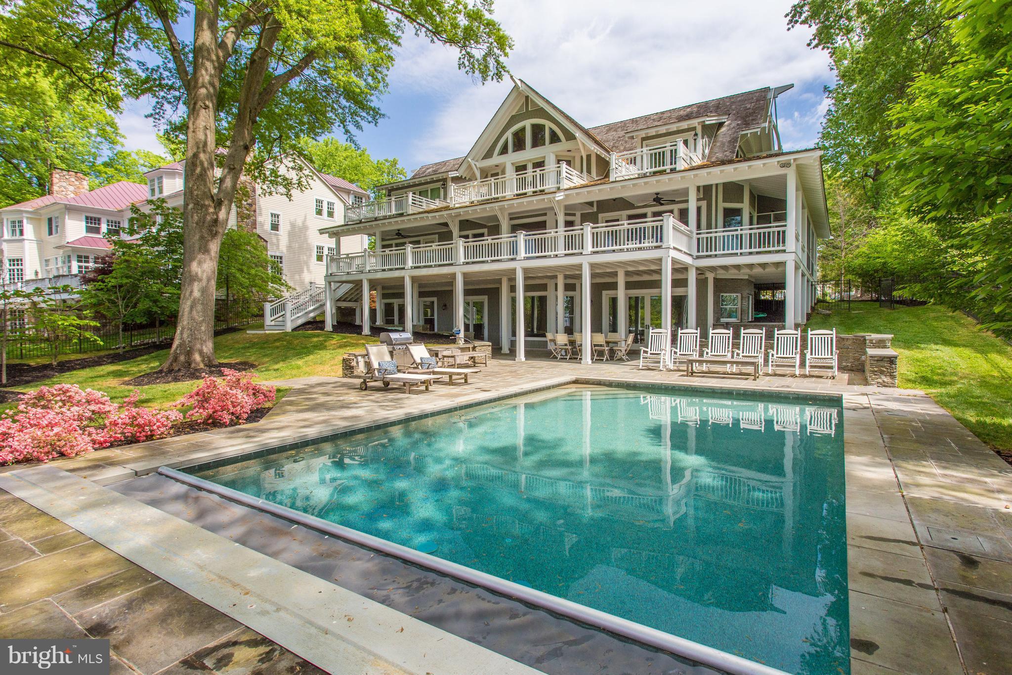 Waterfront luxury--Nantucket style. Coastal Living Idea House designed for indoor/outdoor living w/ private 300-ft dock, cabana, saltwater pool, patio, deck, 3 balconies, screened & front porch. Lighthouse-inspired details incl. knotty pine hardwood flrs, kitchen w/ Italian granite, 2 main-lvl suites, upper fam rm, entertainer's basement w/ game rm & wet bar. Sep apartment above 3-car garage.