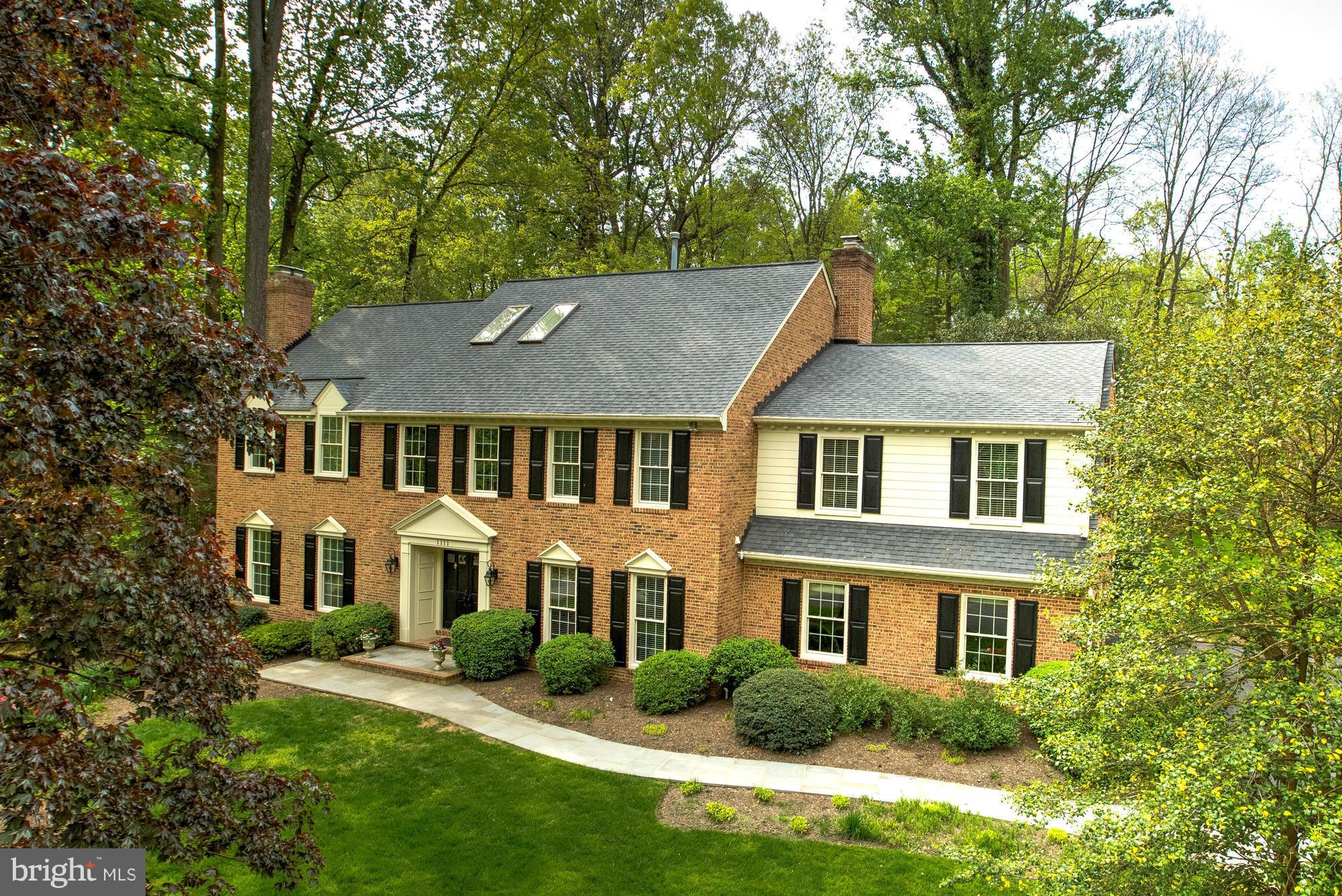 Beautiful brick colonial on over a 1/2 acre. Completely updated throughout - Remodeled kitchen with Wolf appliances, all new bathrooms. 6,500 SF of modern living. 4 BR/4.5 BA. Spacious screened porch leads to an amazing backyard. Master suite with separate sitting room & brand new luxurious bath. Fully finished LL w/ rec room, wet bar, game room & more.