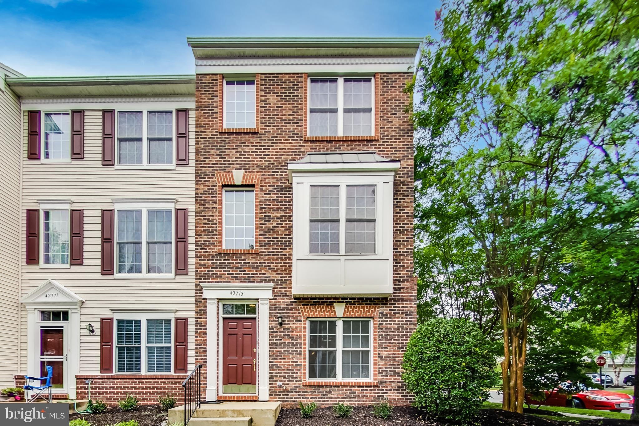 Welcome to this turnkey, end-unit townhome in the fantastic community of Amberlea at South Riding! This wonderful home features 3 bedrooms, 3.5 bathrooms, and over 1,500 SF of living space. As you enter, you will be wowed by the high-ceilings, new paint throughout, and pristine condition. The entry level offers a welcoming foyer, en-suite bedroom with updated, full bathroom, storage, and access to the large, 2-car garage. Make your way upstairs and you will find a spacious living and dining area that opens to a tastefully updated, gourmet kitchen. The kitchen features stainless steel appliances, granite countertops, ample cabinets, and new, designer flooring. Sliding glass doors lead to a spacious back deck – the perfect place to grill or dine outdoors. Also, on the main level, is a powder room and washer/dryer that were replaced in 2019.  The third level features a lovely owner’s suite with a vaulted ceiling, surround windows, sizable walk-in closet, and updated full bathroom. Just down the hall is another en-suite bedroom with high ceilings, lots of light, and updated bathroom. Other notable features include NEW HVAC, recently replaced carpets that were professionally cleaned before listing, & new dishwasher. Amberlea at South Riding amenities include an outdoor pool, community center, playground & other common grounds, jog/walk paths, & lake. Walk to parks, schools & shopping, and easy access to route 50 & Dulles airport - this home is the perfect 10! Offers, if any, will be reviewed on Tuesday at noon.