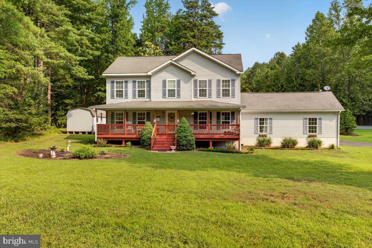 Sellers present a rare opportunity to own on the private side of Lake Anna! Located in the quiet, low-traffic community of Jerdone Island, this property offers exceptional flexibility as a  full-time residence, short-term rental investment, or private family retreat.
Situated on a tree-lined 0.73-acre lot, this well-maintained 3-bedroom, 2.5-bath home blends comfort, functionality, and privacy. The updated kitchen features freshly painted cabinetry, new hardware, and a new sink, while refreshed bathrooms provide a clean, modern feel throughout. The primary suite stands out with a double vanity, custom cabinetry, and striking tile work that extends seamlessly from the floor through the walk-in shower and up the walls.
Designed for indoor–outdoor living, the home offers a  large gated front porch and spacious rear deck with an outdoor shower hookup, ideal for entertaining or relaxing after a day on the lake. The fully fenced backyard and mature tree line create a private setting with plenty of room for pets, play, or outdoor gatherings. Two storage sheds add excellent functionality, including one with electricity—perfect for a workshop, hobby space, or additional lake gear storage.
The home is equipped with two HVAC systems, with the upstairs unit newly installed in 2025. Brand new 2026 water heater and washing machine. The living room includes gas fireplace hookup, allowing for easy future installation if desired. The oversized garage provides ample room for a vehicle, water toys, or storage, along with a durable vinyl-floored entry landing into the home.
Residents enjoy private community lake access with a leased boat slip, just a 5-minute golf cart ride away, making lake days easy and convenient. The neighborhood is known for its privacy, peaceful atmosphere, and minimal traffic. Firefly Broadband is available, supporting remote work, full-time living, or short-term rental guests.
Whether you’re seeking a high-performing lake investment, a weekend escape, or a full-time home, this property delivers privacy, versatility, and prime access to everything Lake Anna has to offer.