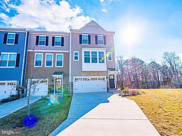 This Beautiful 4 BR-3.5 Bath EOG THS was Built in 2021 & Feels Very New-The Attached 2 Car Garage and Driveway Make this Property Even More desirable-The Property has a Nice Deck Backs to the Woods & Feels Very Private-The Main Level Has an Open Floor Plan that Included a LG Quartz Island Kitchen with a Peninsula Breakfast Bar as Well & A very Spacious LR & DR Area + a Half Bath-There is a Lovely Primary Bedroom & Bathroom + 2 Other BR's & a Hall Bath-The Wonderful Walkout Lower Level Has a Spacious Family Room Area & a Full Bathroom That Makes it Perfect for a 4th BR for Guests! The Lower Level Walks out to a Great Concrete Patio-High-end Features Throughout the Property Including Wide Plank Engineered Hardwood Floors & Very Nice Carpet-Walk-in Pantry-Upper Level Laundry For Your Convenience & So Much More! The Community is Located Near Franklin Square Hospital & BCCC and it has a Great Play Ground & a Dog Park-Available the Last Week of May