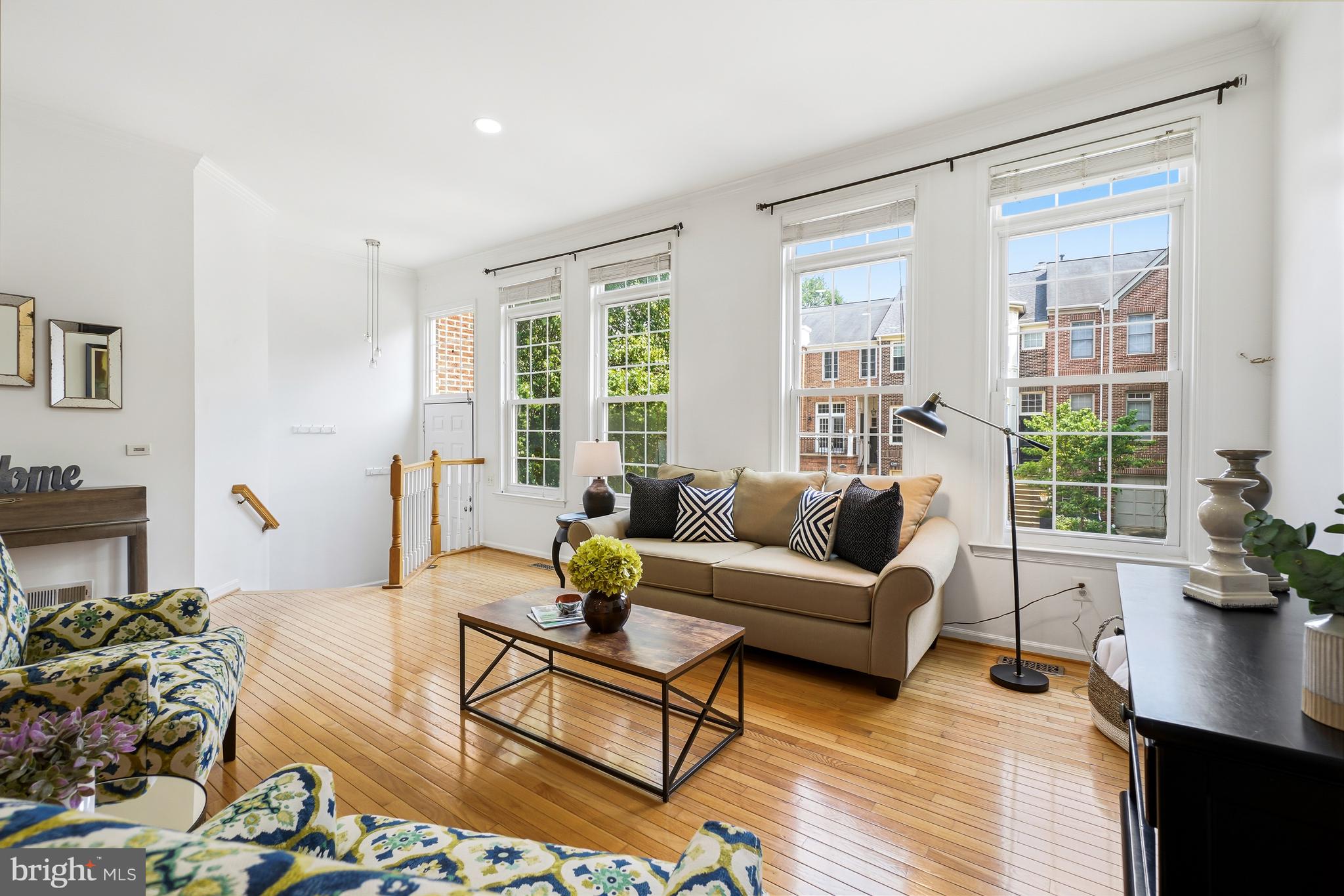 Welcome to this beautiful three-level townhome in the highly sought-after Lowes Island community, offering a classic brick front exterior and a light-filled open-concept main level pre-wired for a built-in surround sound system. This home offers updates galore . Updated kitchen with granite, newer SS appliances SS  plus custom expanded cabinetry, ample storage, and a seamless flow to the spacious upper deck overlooking a tranquil tree-lined lot. main level has full hardwood floors.  Updated powder room on main The fully fenced backyard with a paved patio provides the perfect setting for entertaining and everyday enjoyment.

Upstairs, three generously sized bedrooms offer abundant light, while the two updated bathrooms showcase new updates and  contemporary lighting and finishes, all complemented by neutral paint throughout. The newly  finished lower, complete with fireplace and walk out to patio  has exceptional flexibility for a fourth bedroom or guest suite, complete with a fully updated 3rd bath,  plus  recessed lighting, and a comfortable gathering area. With approximately 2,600 square feet of finished living space, plus a two-car garage with EV charging, this home truly has it all.