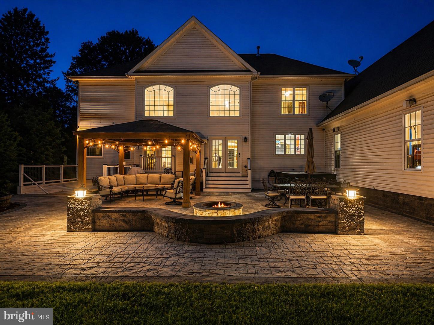Perfect Multi-Generational Estate with Full In-Law Suite | 2 Kitchens & Smart-Home Integration
Experience a rare combination of massive scale, modern sophistication, and complete privacy on nearly two wooded acres in Gainesville. Originally built in 2008 and meticulously reimagined with over $200k in luxury upgrades in 2023, this 8-bedroom, over 7,000-sq-ft of beautiful living space, there is room for everyone.  The home showcases timeless architecture with striking stone and siding and best of all, there is NO HOA, meaning you have full freedom to enjoy your property.
The "House Within a House" (Multi-Generational Luxury):
This isn't just a large home; it’s a versatile sanctuary. The main level anchors daily life with a gourmet kitchen featuring high-end appliances, a large center island, and an open flow into grand formal and casual spaces.  Master bedroom on main level, 3 additional bedrooms (1 en-suite and 1 jack and jill) upstairs with a 4th bedroom above the garage (en-sute) Basement has 3 additional bedrooms and 2 full bathrooms, laundry room, kitchen and living room – creating the perfect environment for an in-law suite, guest quarters, or long-term multi-generational living without compromising privacy.
A Smart-Home Powered Lifestyle:
For the tech-forward buyer, this estate is fully equipped for the future. The home is integrated with aControl4 Smart Automation System where luxury convenience is built-in, from the 85-inch mounted entertainment system to the Tesla charger in your conditioned 3-car garage, which features its own dedicated HVAC system.
Reimagined Backyard Oasis:
Step outside to a completely private retreat backing to lush trees. Your new 40' x 45' stone patio is the ultimate stage for sunset gatherings, unforgettable summer parties, featuring a built-in firepit, gazebo, hot tub, and integrated outdoor audio. Whether you’re hosting dozens on the expansive driveway or enjoying a quiet morning in the primary suite’s spa-inspired bath, every detail has been curated for an elevated lifestyle.
Location & Scale:
Space: 8 Bedrooms, 6.5 Baths across three finished levels.
Practicality: Massive Parking, oversized heated 3-car garage plus driveway space for 12 cars, boats, or an RV.  Fresh whole-house paint, new lighting, and relocated HVAC units for maximized outdoor use.
Commuter's Dream: Peaceful country feel, but only minutes from Interstate 66, Route 15, and Route 29.