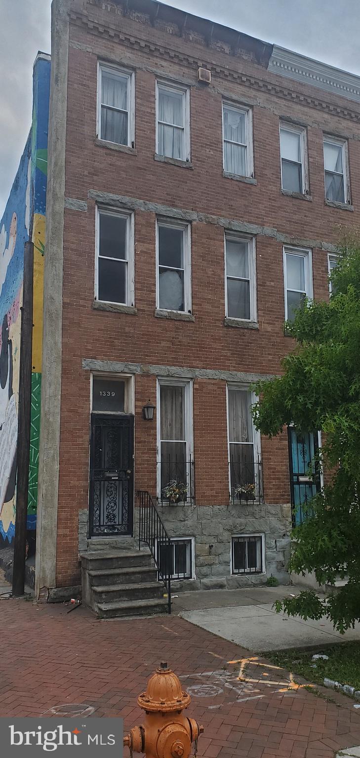This is a rare opportunity to purchase a property in a prime location in the East Baltimore Midway/Oliver Community.  This is a four (4) bedroom and one and a half  (1.5) bath with the option to have an office space or separate living quarters on the first floor.  The location is prominent as the building is located at the corner of North Avenue and Harford Road, across from the Eastern District Courthouse.  You know the building with the city mural on the side wall.  This location offers access to nearby businesses,  churches, schools, and travel routes.  Development is happening all around this location.   The possibilities abound for this space located in the heart of Baltimore.