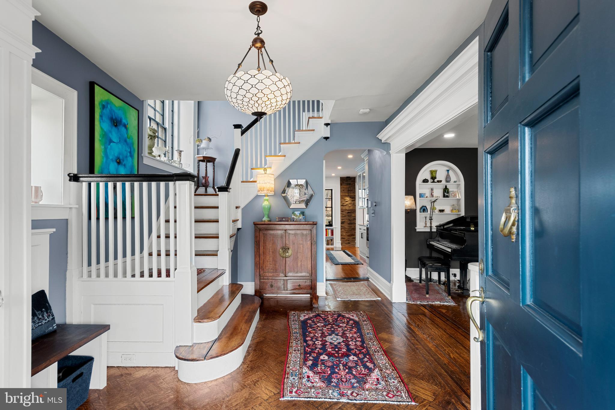Built in 1925, this classic stone colonial in West Mount Airy seamlessly blends timeless architectural details with contemporary comforts. This meticulously maintained home features five bedrooms, two full baths, and two half baths, and provides a rare opportunity to own a detached single-family home on Lincoln Drive .As you approach the home on the flagstone walkway, you pass specimen trees and flowering perennials, and find a large front porch that invites you into the residence. Every detail of this property has been lovingly restored, and we look forward to finding new owners to take stewardship of this stunning home.The spacious living room has bright windows that fill the room with sunlight and features original mahogany inlaid hardwood floors found throughout the house. A stone-framed gas fireplace with wood mantle stands proudly in the room. Original wood moldings and a built-in wall niche remind you of a bygone era. The large dining room with its original pocket door, flows from the living room and is filled with windows and sunlight overlooking the gardens.The gorgeous new kitchen is a chef's delight. It features bespoke tiling work, heated floors, tons of storage and counter space for all of your cooking and baking needs, Bosch appliances, a 6-burner gas cooktop, a double oven, leather-finish granite countertops, and a farm sink. In keeping with the home's era, the kitchen cabinet color reflects the home's original style. From the kitchen you exit to the peaceful fenced-in backyard filled with charming trees framing lush flower beds, two raised herb gardens, a relaxing fire pit, and a lovely slate stone patio with plenty of room for outdoor entertaining and dining.As you meander through the home, you will find a charming powder room on the first floor with original accents. A stately palladium window graces the central staircase. An additional powder room on the second floor is highlighted by a pressed copper ceiling.The primary bedroom suite is drenched in sunlight and includes an attached walk-in dressing room with custom cabinetry throughout. The en-suite bath showcases stunning glass tile, a stone accent wall, heated slate floors and bench, a soaking tub, and double vanity. A great room also anchors this floor and currently provides an entertainment space and library. This grand room is filled with windows, light, and endless possibilities for future owners.The third floor boasts 3 additional rooms each with an ample walk-in closet – currently a full-sized laundry room, a guest bedroom and a home office -- as well as a second full bathroom.From the backyard, you can access a detached stone garage that provides additional storage and architectural beauty to the property. This outbuilding could easily be converted to a studio or workshop space. The full unfinished basement is also accessible from the yard. It is clean and dry and allows ample access to all the home’s updated infrastructure. Extensive native and pollinator gardens, central air conditioning, and radiant gas heat are additional benefits to this home. 6521 Lincoln Drive is located within easy walking distance of the train and all that Mount Airy and Chestnut Hill offer, along with the beautiful trails and the running paths of the Wissahickon Valley. With comprehensive modern upgrades, beautifully curated outdoor spaces, and an unparalleled historic setting, this home offers a rare blend of comfort, character, and convenience. It is truly move-in ready, and designed for long-term enjoyment. This home should not be missed.