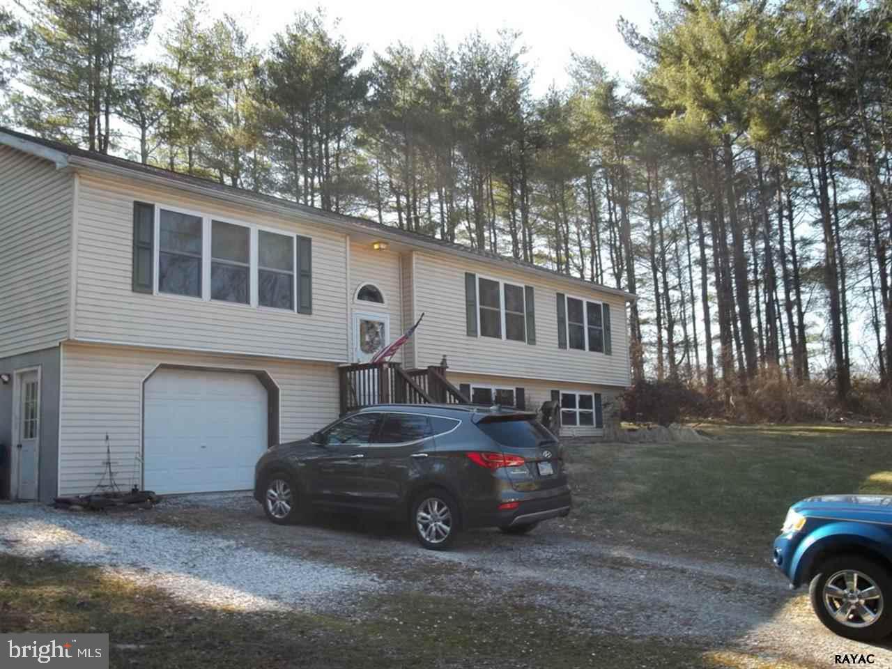 Secluded high rancher on 3.04 acres with above ground pool.
