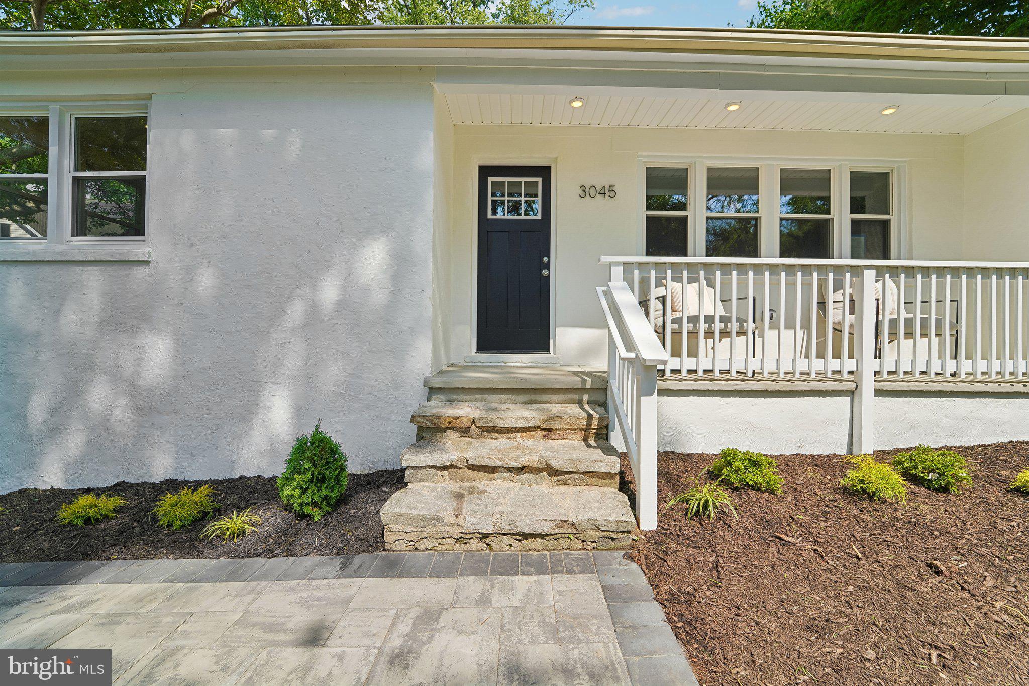 Completely updated home in sought-after Ellicott City offering modern finishes, spacious living areas, and excellent outdoor space. A welcoming front porch leads into the main level featuring a large living room with fireplace, gourmet kitchen with breakfast bar, stainless steel appliances, dining area, and wood floors throughout. The main level also includes a primary suite with private bath, plus 2 additional bedrooms and an updated hall bath. The partially finished lower level offers a spacious family room, additional bedroom, and full bath, providing flexible living space for guests, recreation, or home office needs. Enjoy the screened-in porch and rear deck overlooking the large yard, perfect for relaxing or entertaining. Conveniently located near shopping, dining, parks, and major commuter routes.  Brand new roof, HVAC, water heater and appliances.  A wonderful opportunity to own a beautifully updated home in a desirable location!