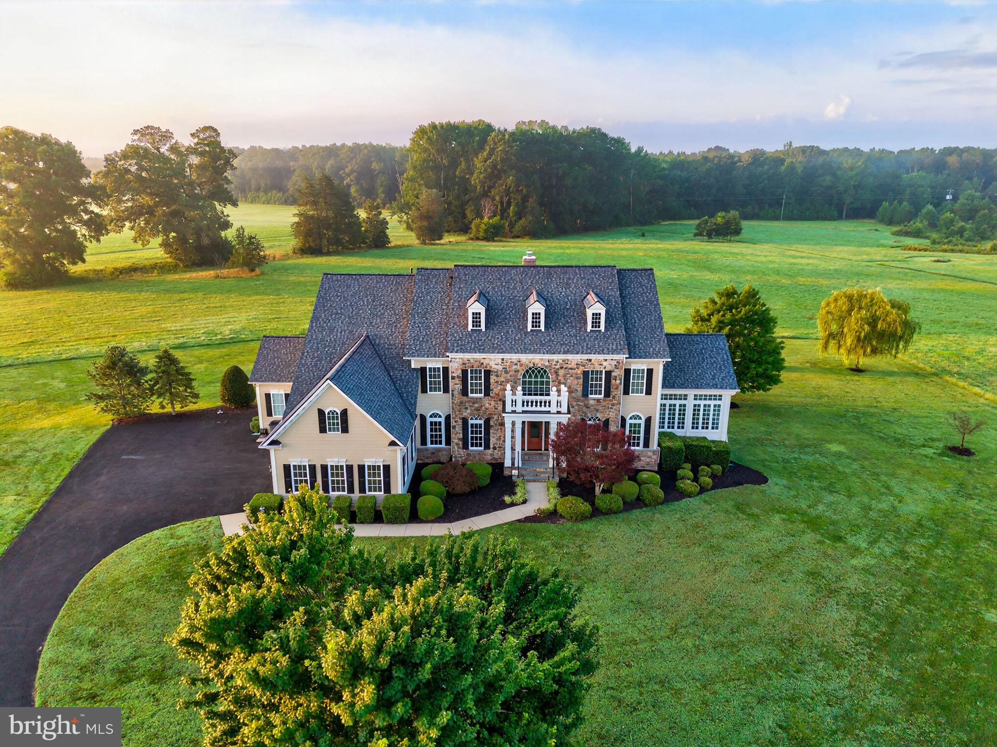 Custom built in 2007 with a passion for quality and impressive interior design, 10895 Justabout Farms Lane is an upscale retreat style estate.  Offering all the elements of extraordinary country living, without sacrificing immediate access to the conveniences required for a busy lifestyle.   

Seemingly right off the pages of Traditional Home magazine, the elegant entry offers an awe-inspiring welcome.   Thoughtful design & carefully selected details lend to the sense of sophistication, but this home was designed to be relaxing and comfortable.   

Soaring ceilings, impressive mouldings, rich woods, and trendy accents create elegant living spaces throughout this home.  The floor plan flows easily and offers ever-changing pastoral views from almost every room in the house.  The setting is particularly lovely when experienced in the conservatory, where you are literally enveloped by nature.

Equipped with top-of-the-line Viking appliances, the gourmet kitchen was designed to function as beautifully as it looks.   A central part of this home, it is a well-loved place for impromptu gatherings, easily flowing over to a cheerful morning room, sunny breakfast room and amazing outdoor spaces!    The great room features soaring ceilings, a cozy wood-burning fireplace with stone mantel and attractive, custom built-ins. 
 
The owner’s suite is a peaceful sanctuary and a highlight of this home.   A three-sided fireplace can be enjoyed from the sitting room and the expansive bedroom with two walk-in closets.  The luxurious spa-like bathroom has been recently updated and includes a walk-through shower with dual shower heads, a jetted tub and custom tile work.

There have been many noteworthy updates in recent years…. just to mention a few:   a new architectural shingle roof was installed in 2021, including a 50 year wind damage warranty; a new hybrid water heater was installed in 2023;  all 4 HVAC systems were replaced with upgraded Trane systems between 2018-2022; and a new Provia Signet Custom Front Door was installed;  Upgraded Amare- garage doors.    PLEASE ASK FOR A COMPLETE LIST OF FEATURES AND RECENT UPDATES.
Also worth mentioning, this house was built using 2x6 framing and Hardieplank & stone siding, selected for enhanced stability and premium insulation qualities.  Additionally, two 200AMP Electric Panels installed with whole house surge protection.  

Outside, a Fantastic raised sundeck and gazebo were added for for al-fresco dining and hours of nature watching and stargazing.   

Car afficianados will love the well-appointed, three car garage with epoxy coated floor, perfect for storing and showcasing your favorite vehicles.   

Perfectly sited at the end of a culdesac in Effingham Farms, a small enclave of luxury estate homes with broad streets and long views of open meadows, shady trees and ponds.   Neighbors enjoy a quiet stroll through the community along wide, paved roads with low-speed limits and no “through” streets.   The setting is peaceful, and the area is still pretty rural, but the location is super-convenient to Northern Virginia for commuting, shopping and amenities.