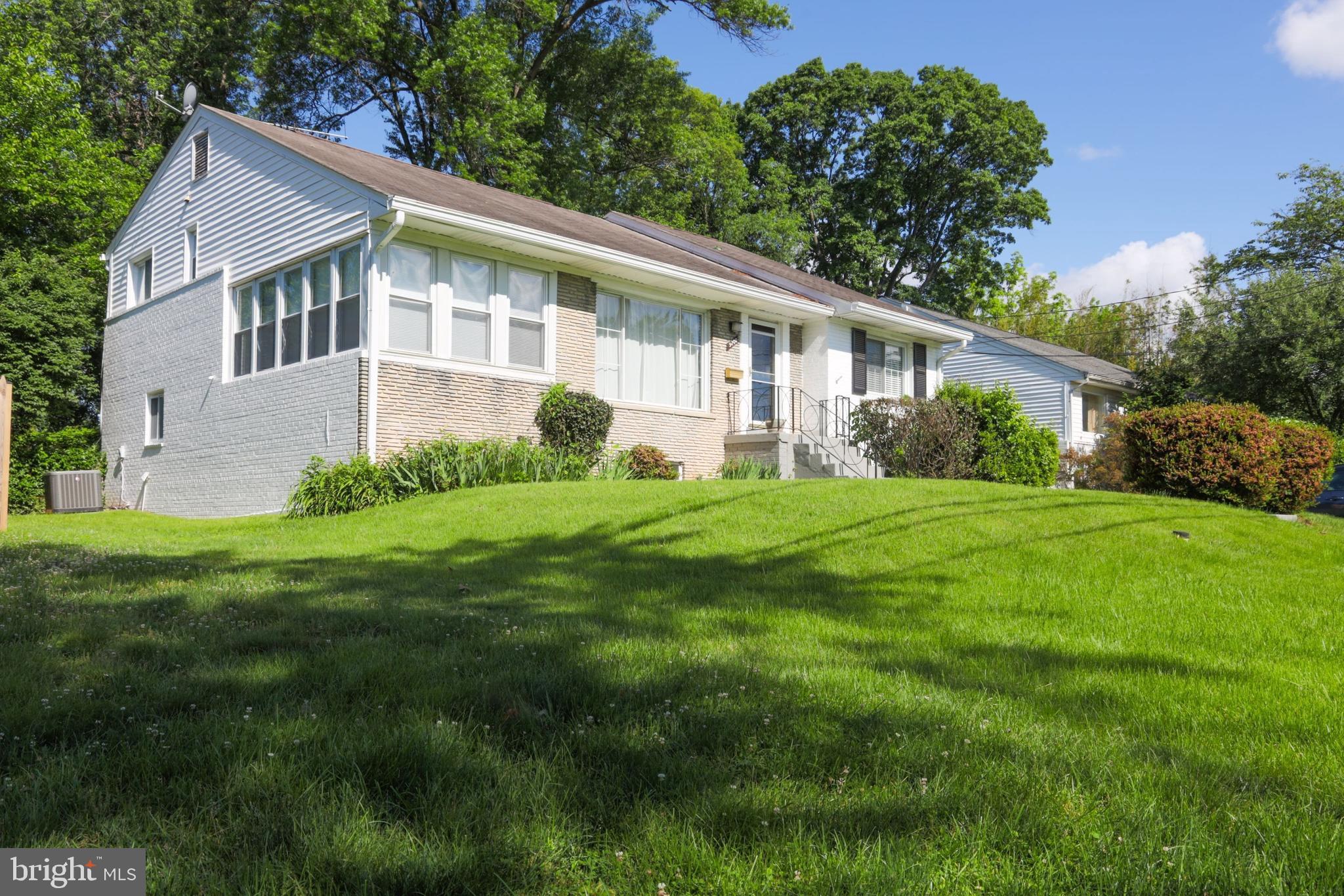 Beautiful home with cathedral ceilings, a separate dining room, and a family room with a fireplace. In a convenient location, within walking distance of the Metro.