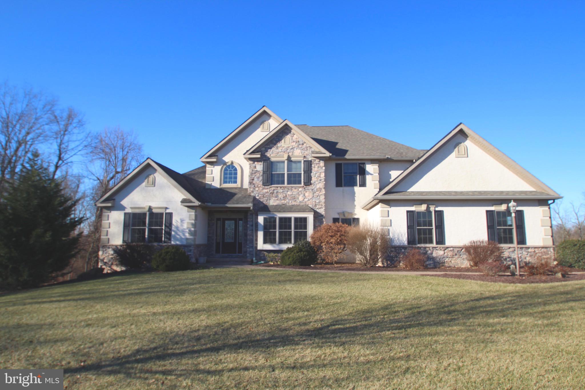 Amazing 4.65 acre  property is the site for this stunning open contemporary home  with first floor owners suite and a finished  daylight basement(includes full bath) for the most discriminating hobbyist, home theater buff or....YOUR USE! Custom kitchen will delight with granite, double ovens and 5 burner gas range. The 2 story great room is stunning with gas FP, lots of windows and is open to the kitchen and the loft above. Dining room with 10x20 closet & built-in window seat. First floor office or LR for todays lifestyle. The 1st floor owners suite features crown molding, tray ceiling with uplighting, a fan, expansive windows and a generous size in addition to an oversized walk-in closet and on suite bath with walk in shower and jetted tub. Custom built this home has upgrades galore and is meticulously cared for. A must see for anyone desiring a country estate, privacy, elbow room from your neighbors or even a place for the horses. The loft could easily be Br #4 and the lower level could readily accommodate extended family as an in-law apartment.