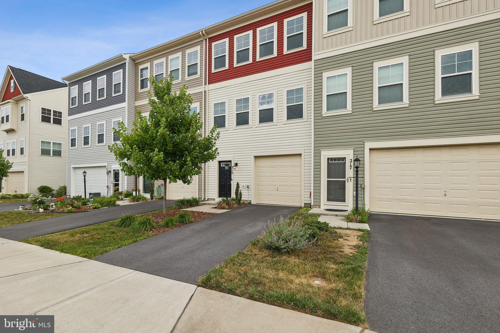 Experience the exceptional lifestyle of Snowden Bridge, one of the Shenandoah Valley's premier master-planned communities, just minutes from Downtown Winchester. Surrounded by breathtaking mountain views, this sought-after neighborhood offers an impressive collection of resort-style amenities, including a 15,000-square-foot indoor sportsplex, swimming pools, playgrounds, scenic paved walking trails, a dog park, picnic pavilion, onsite daycare center, and an elementary school. Conveniently located near Route 7, I-81, and I-66, commuting to Northern Virginia is both easy and convenient. This beautifully maintained three-level townhome offers over 2,100 square feet of finished living space with 3 spacious bedrooms, 2 full bathrooms, and 2 half bathrooms. The bright and open main level features gleaming hardwood floors, abundant natural light, and a spacious kitchen with ample cabinetry, generous counter space, and a breakfast area that flows seamlessly to a huge deck, perfect for entertaining, outdoor dining, or simply relaxing. Upstairs, you'll find a generous primary suite along with two additional spacious bedrooms and two full bathrooms. The conveniently located upper-level laundry, complete with a washer and dryer, adds everyday convenience. Combining modern design, functional living spaces, and outstanding community amenities, this move-in-ready home is the perfect place to call home