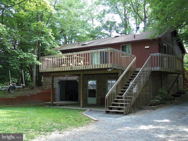 Raised Rambler sitting on 1.14 Acres has 2/3 Bedrooms and 2 Baths, a nice Large Garage, Deck and Shed.   New Granite in Kitchen and New Stone on outside. Wood stove to stay with the house!