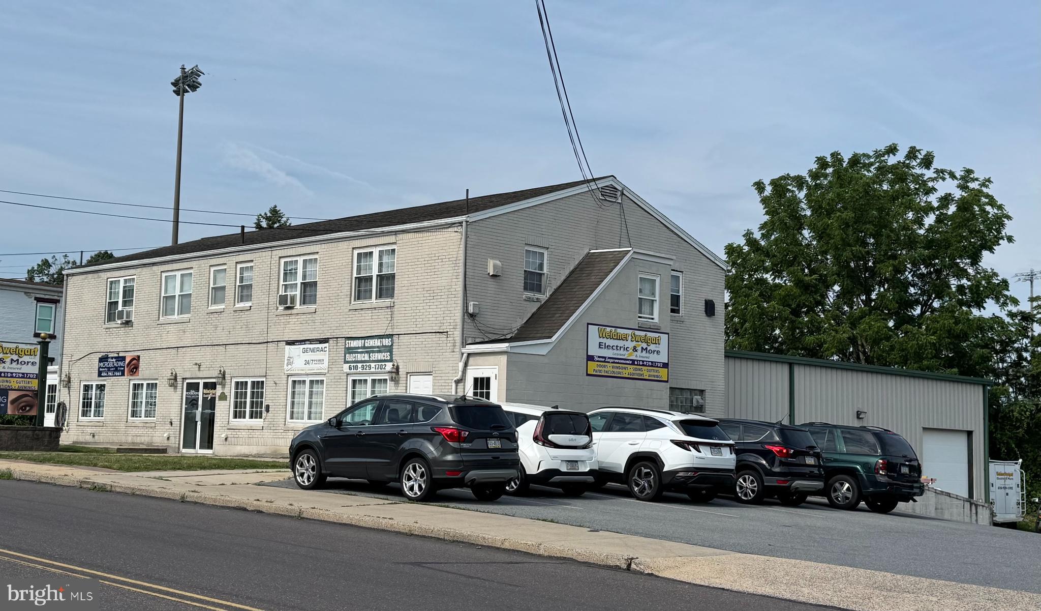 This versatile mixed-use property features an original 1,800-square-foot brick building combined with a 3,000-square-foot warehouse addition (w/ 10x14 overhead door) offering a wide range of commercial and investment opportunities.  The original building includes two office suites on the first floor (1st floor has Central Air) and four one-bedroom, one-bathroom apartments on the second floor, providing multiple income streams. The warehouse addition features overhead doors, a half bathroom, and ample space for storage.  Additional highlights include off-street parking, gas heat and a flexible layout suitable for owner-occupants, investors, or businesses seeking a combination of office, warehouse, and residential rental income.